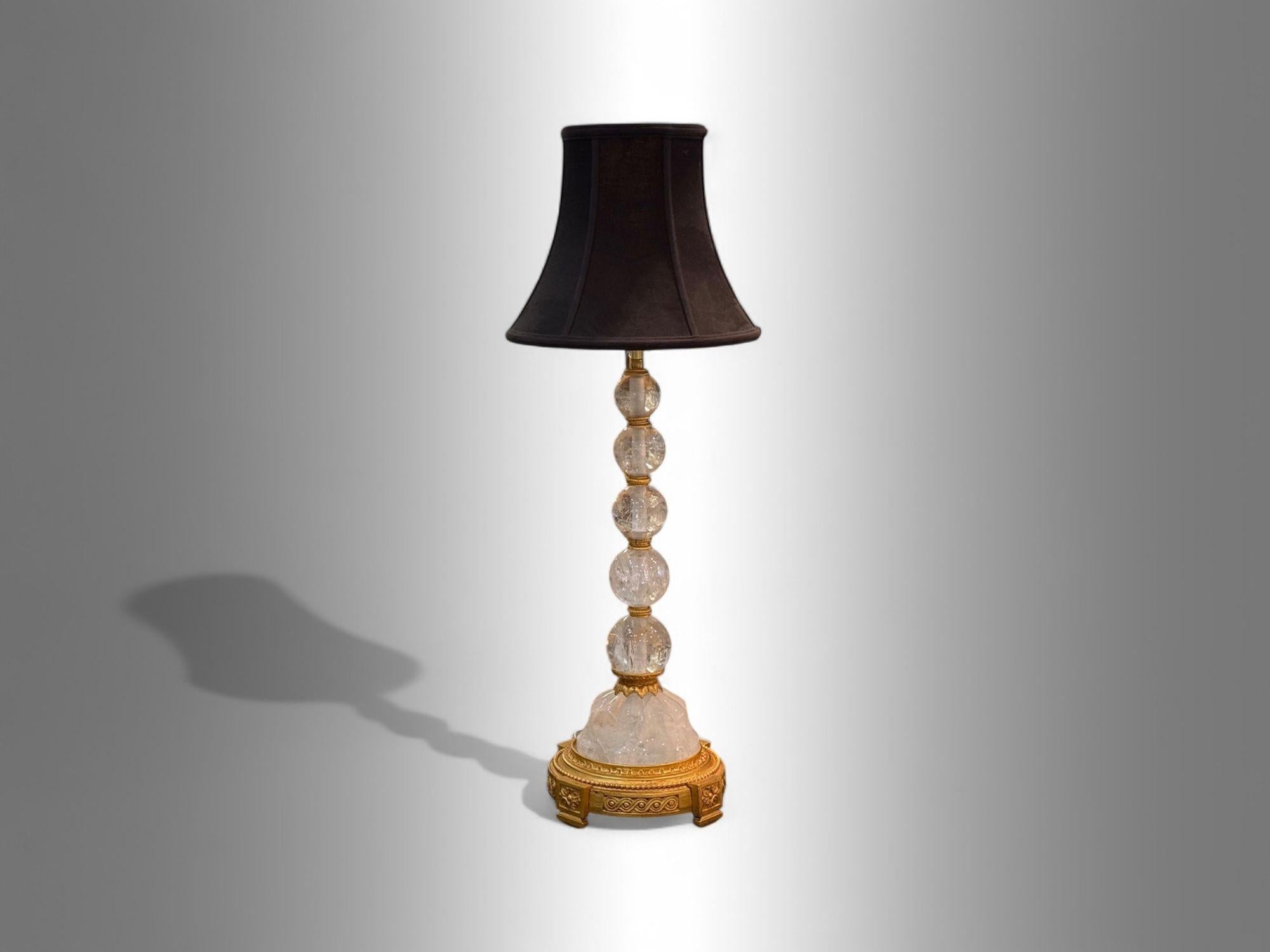 Hollywood Regency, Rock Crystal, Bronze, Table Lamps, France, 1960s

A refined pair of Hollywood Regency or Art Deco-style table lamps featuring gilt metal supports and rock crystal. Each lamp displays a cluster of graduated rock crystal spheres,