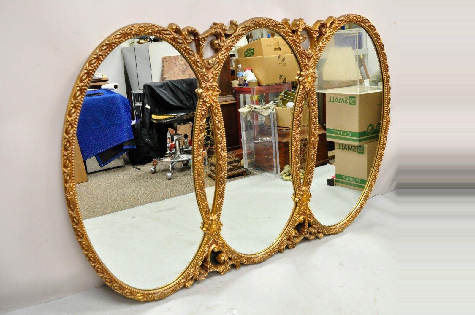 Hollywood Regency Rococo triple oval ring Triptych Interlocking wall mirror. Circa mid 20th century. Measurements: 45