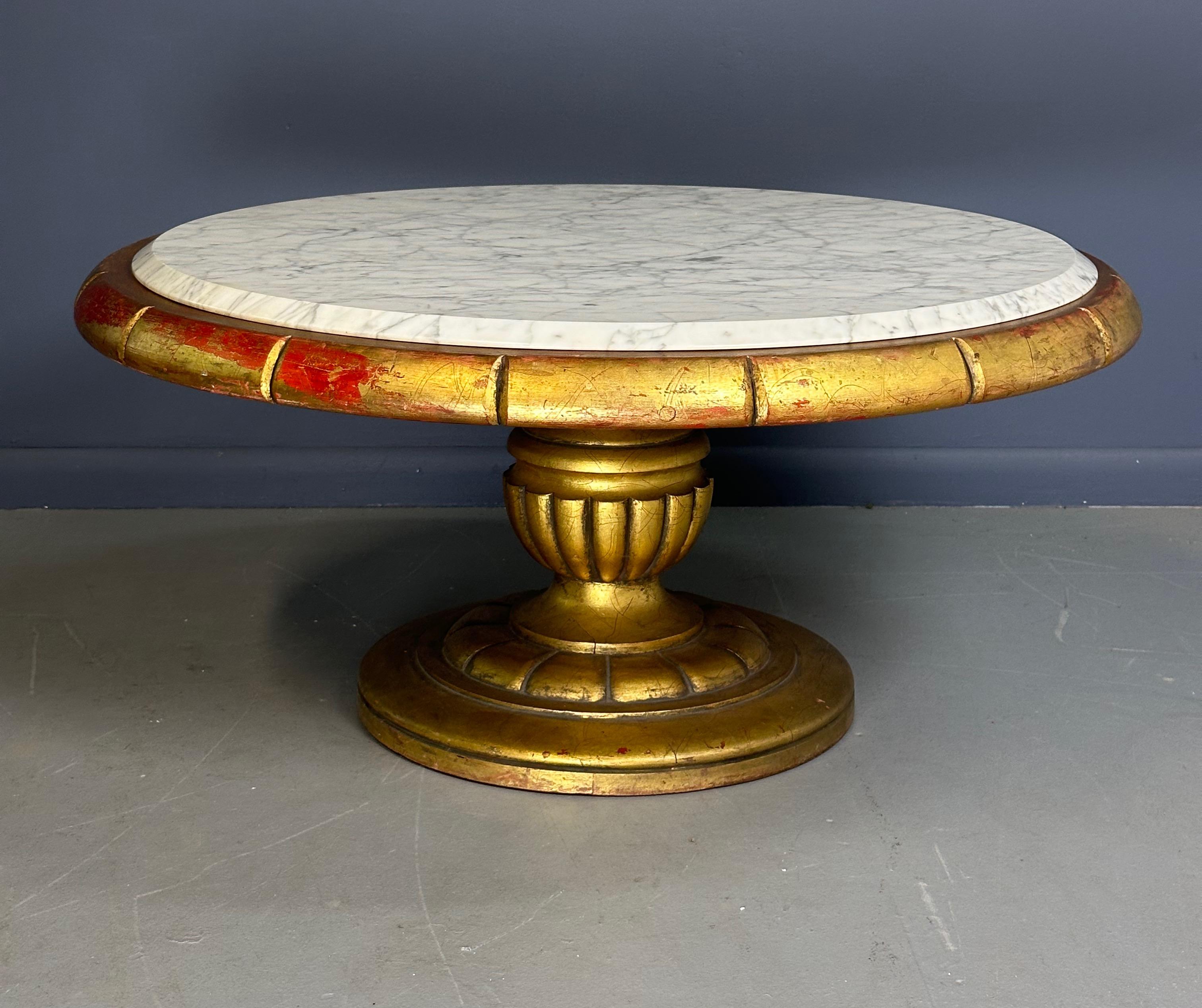 Elevate your living space with our Hollywood Regency Round Cocktail Table. The luxurious gold and marble design, inspired by James Mont circa 1970's features a gold gilding over a Chinese red wood base with thick marble slab top.

