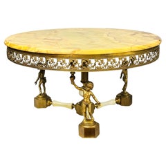 Mesa de centro redonda de estilo Hollywood Regency, con putti de ónix y bronce dorado, década de 1960