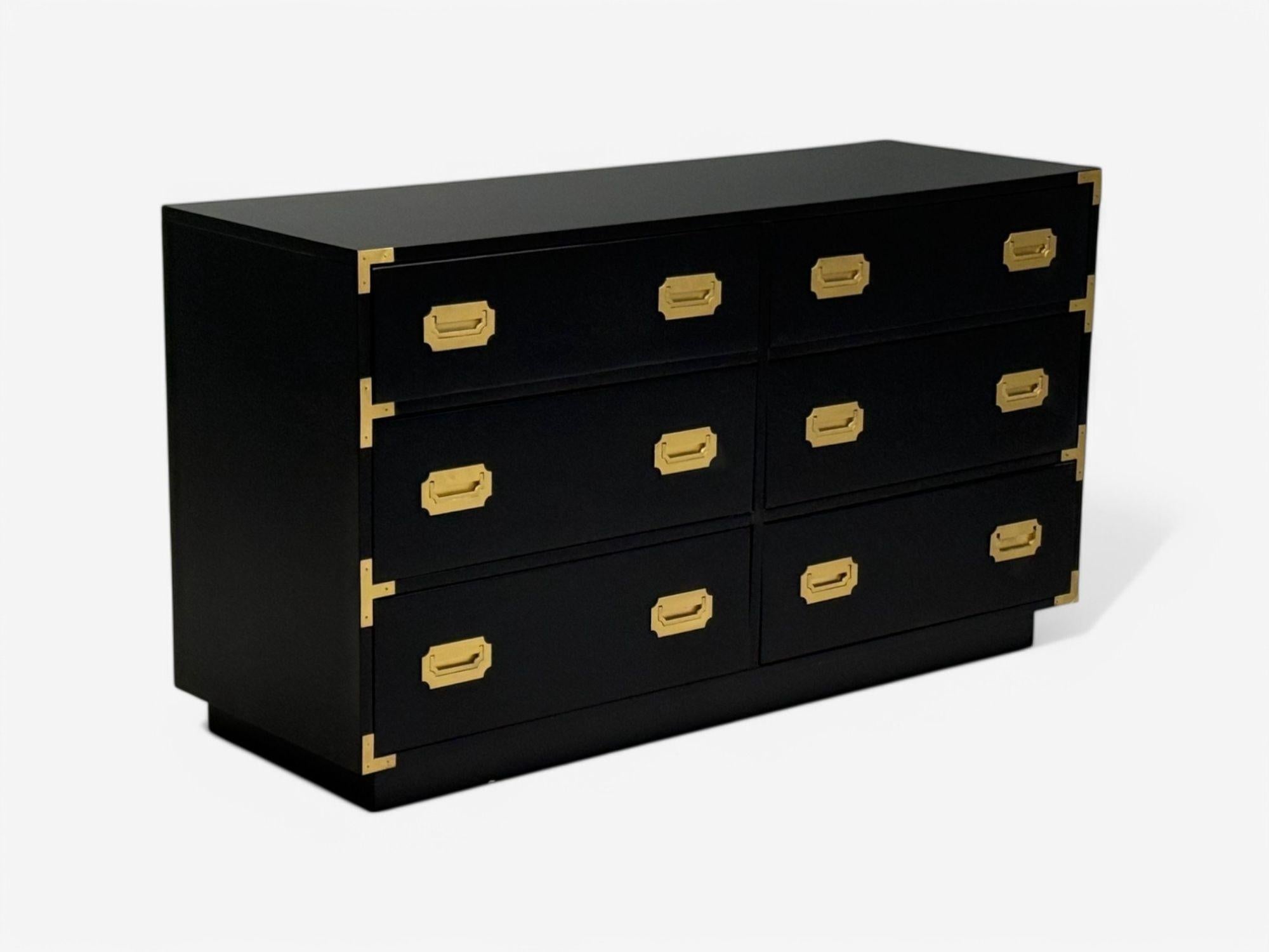 Hollywood Regency, Satin Black Wood, Brass, Campaign Dresser, USA, 1970s

A single mid-century modern campaign dresser designed and produced in the United States, circa 1970s. This example has been newly refinished with a black satin finish. The