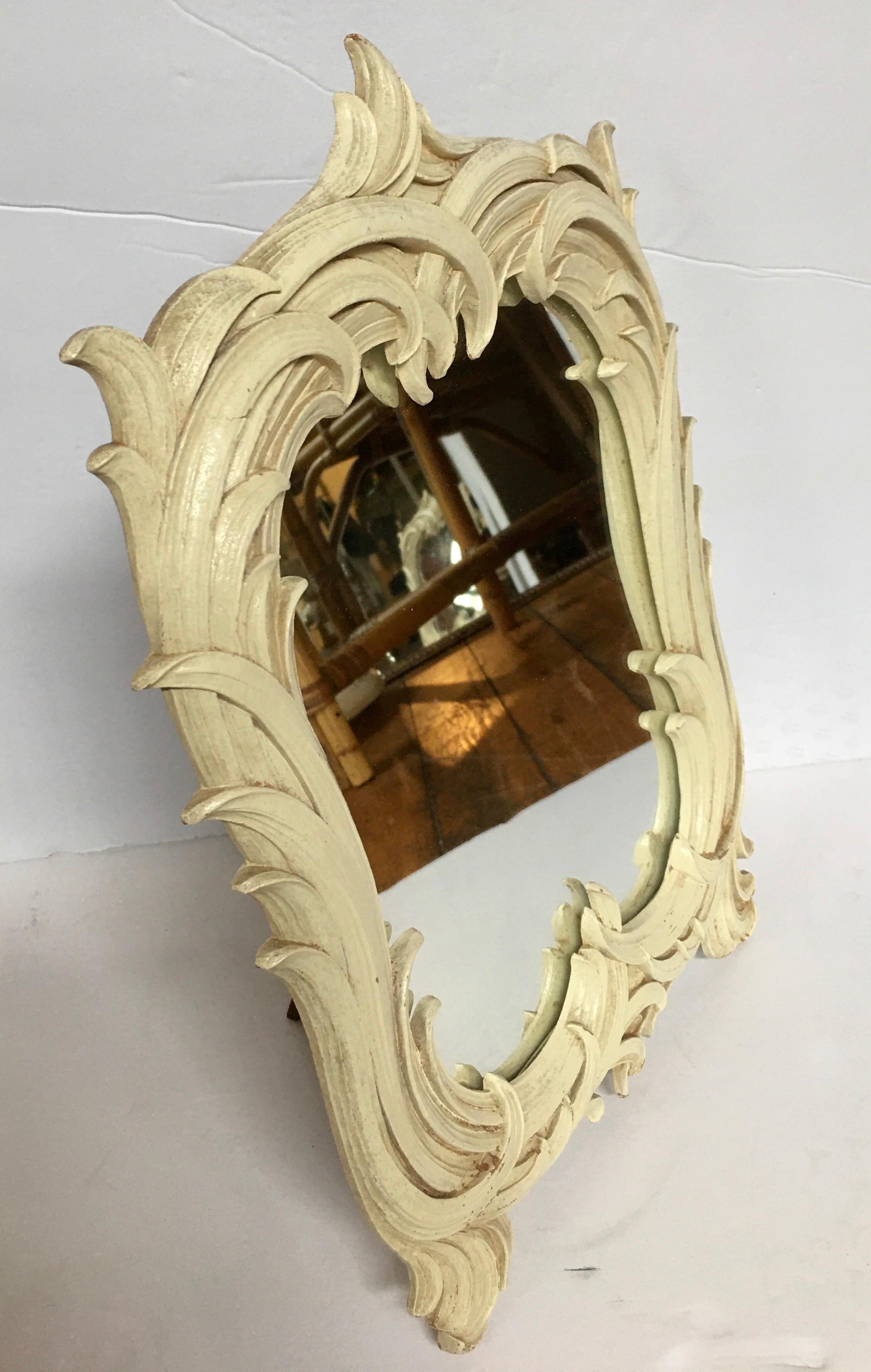 Hollywood Regency Serge Roche style palm leaf mirror featuring a plaster-like matte cream finish. This sculptural palm frond form mirror can be displayed on a tabletop or hung on the wall with the addition of a wire.