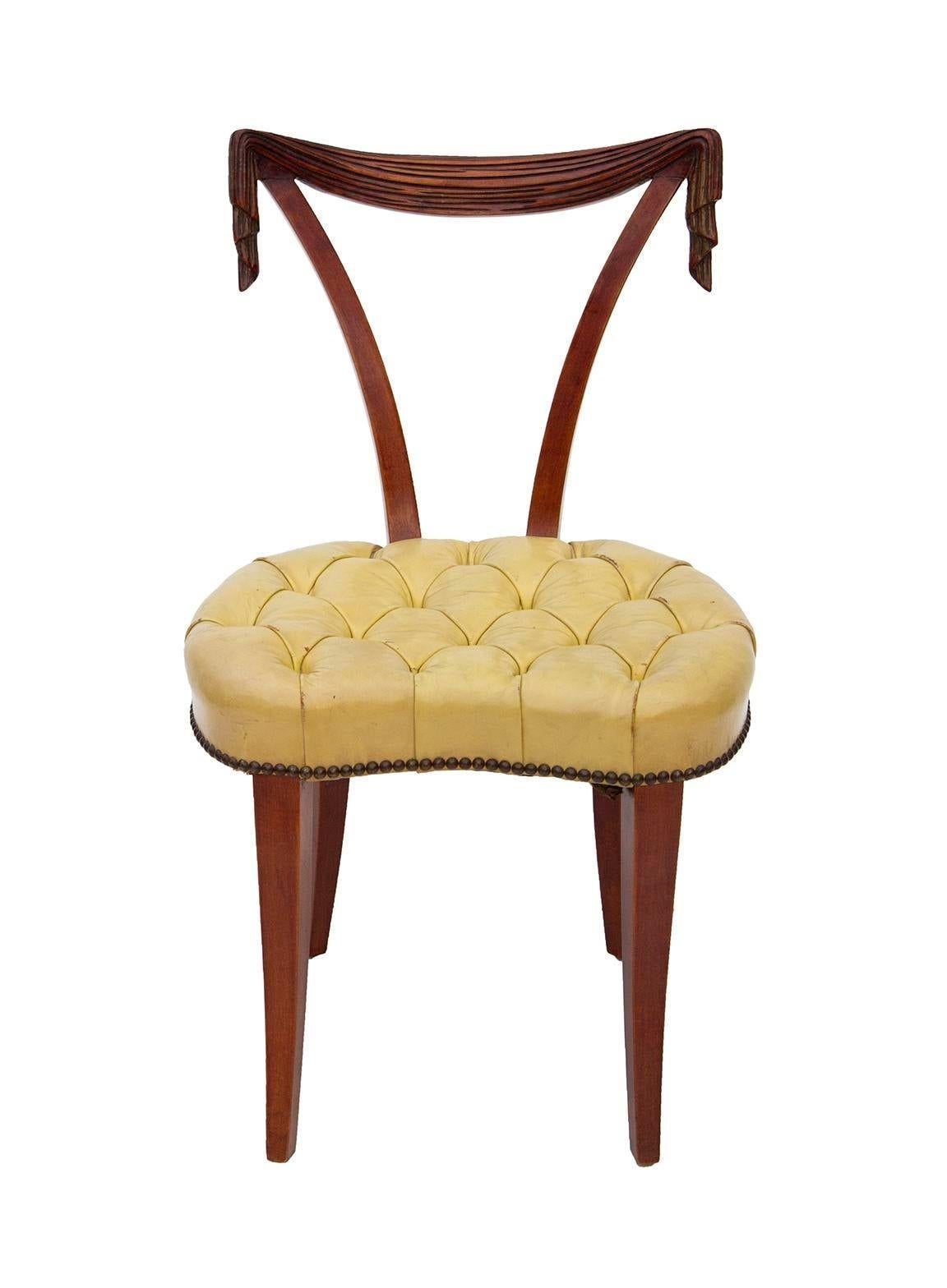 USA, 1940s
Hollywood Regency swag back or 'draped' occasional chair by Grosfeld House, circa 1940s. Tufted pale yellow leather seat and natural mahogany finish. Classic form that could add beauty to a variety of settings. This would be a beautiful