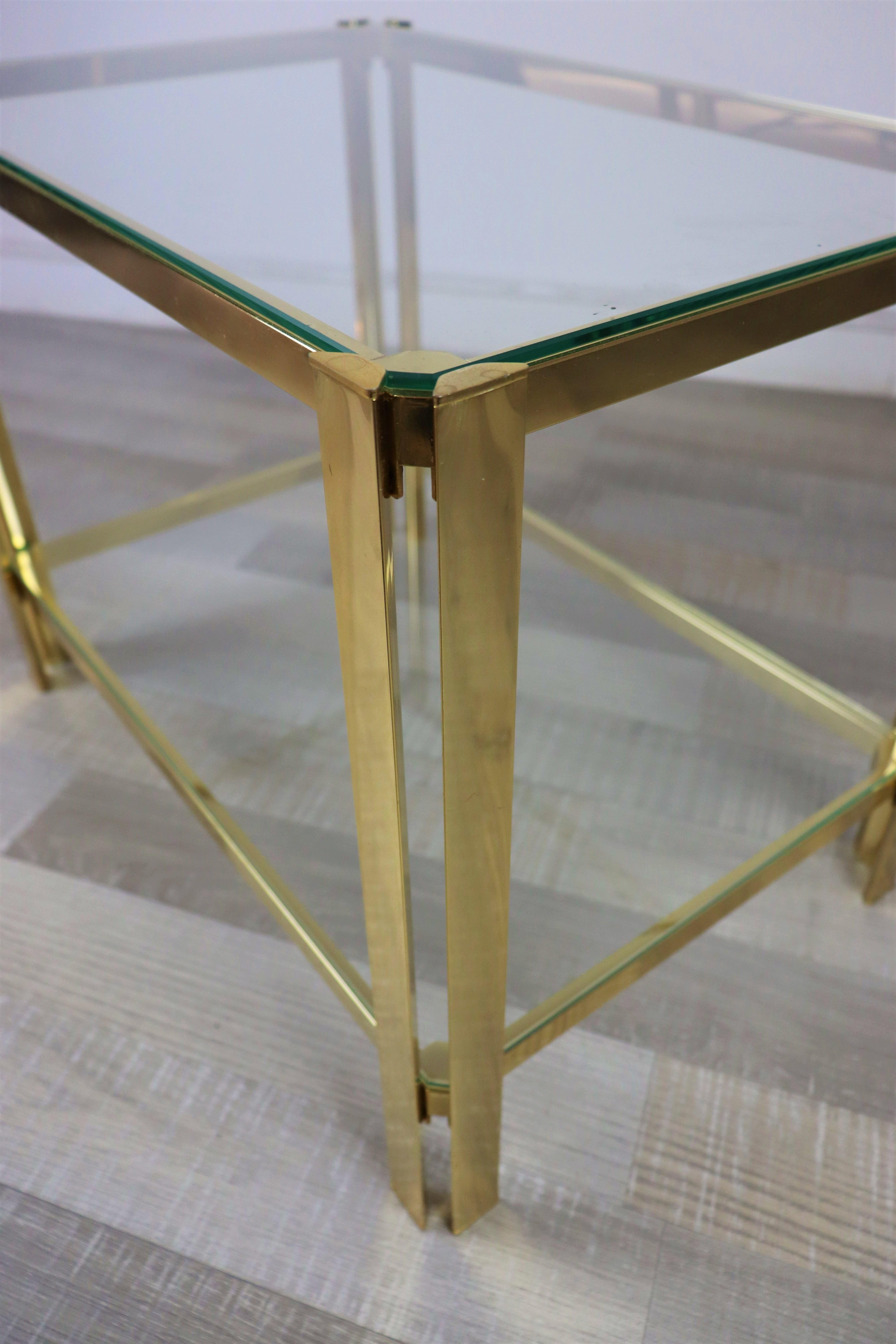 Brass and glass, Hollywood Regency small side table in the style of Pierre Vandel, in a very good condition. Paris, 1970