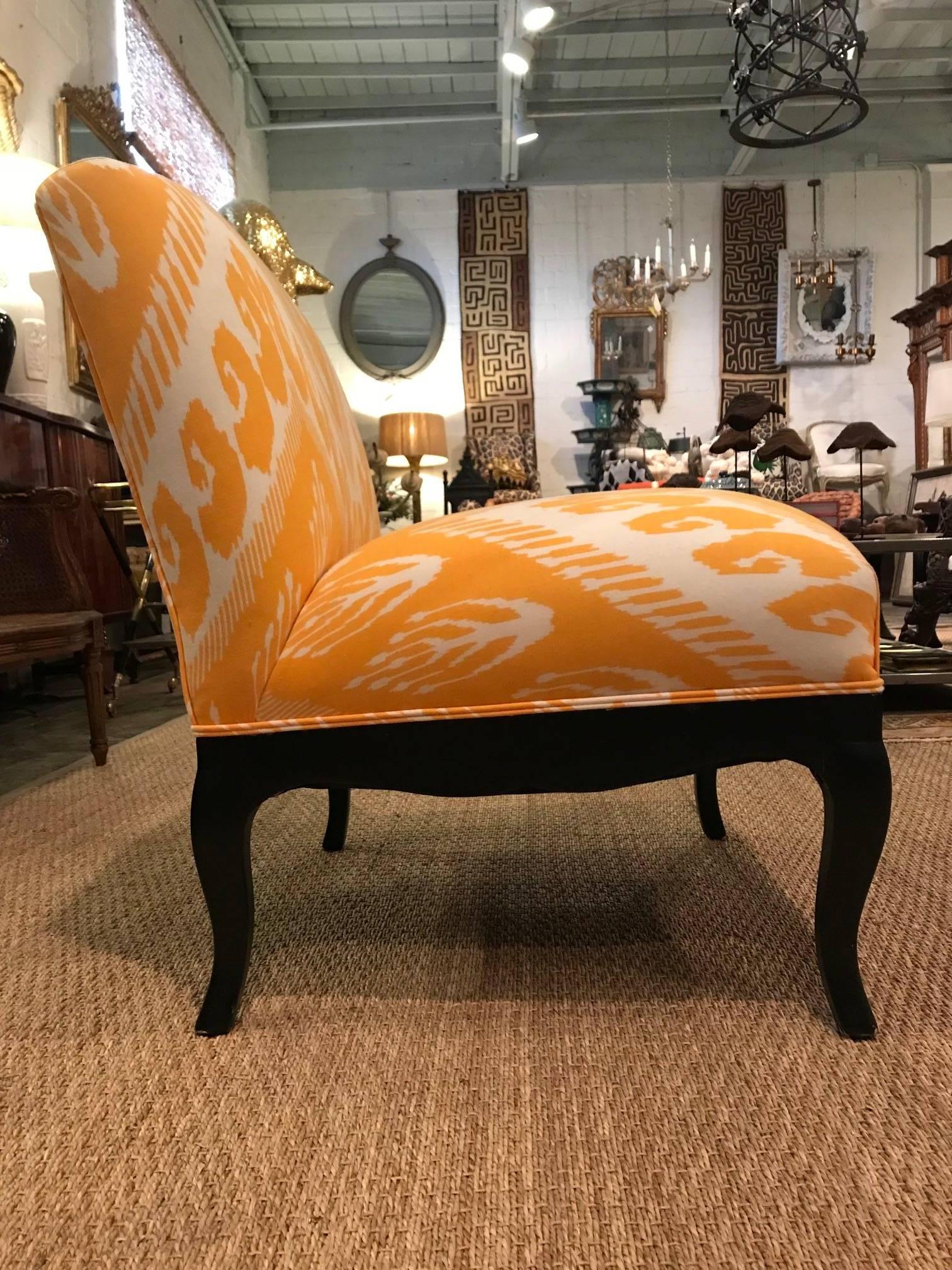 Slipper chair in Saffron Ikat fabric designed by Michelle Nussbaumer 
Welt trim
Black painted curved legs and curved side and front rails.