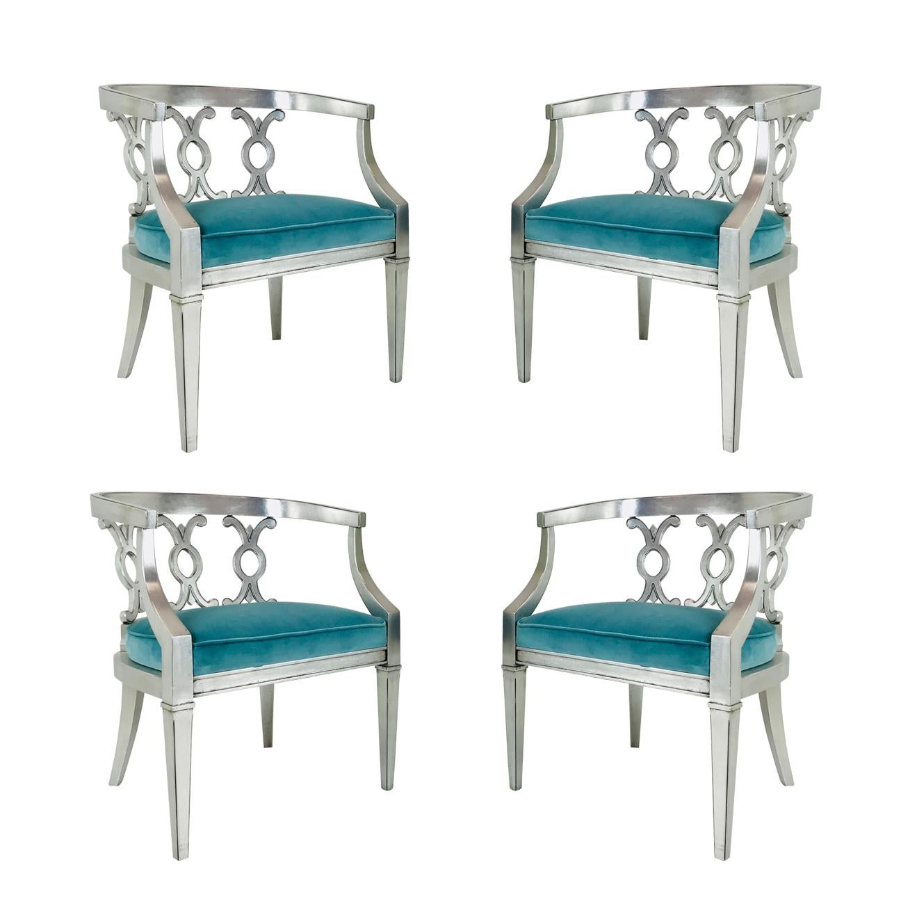 Pair of Hollywood Regency sliver leaf armchairs with turquoise velvet. Newly refinished and upholstered.
There are two sets of pairs available.

Dimensions:
23.5