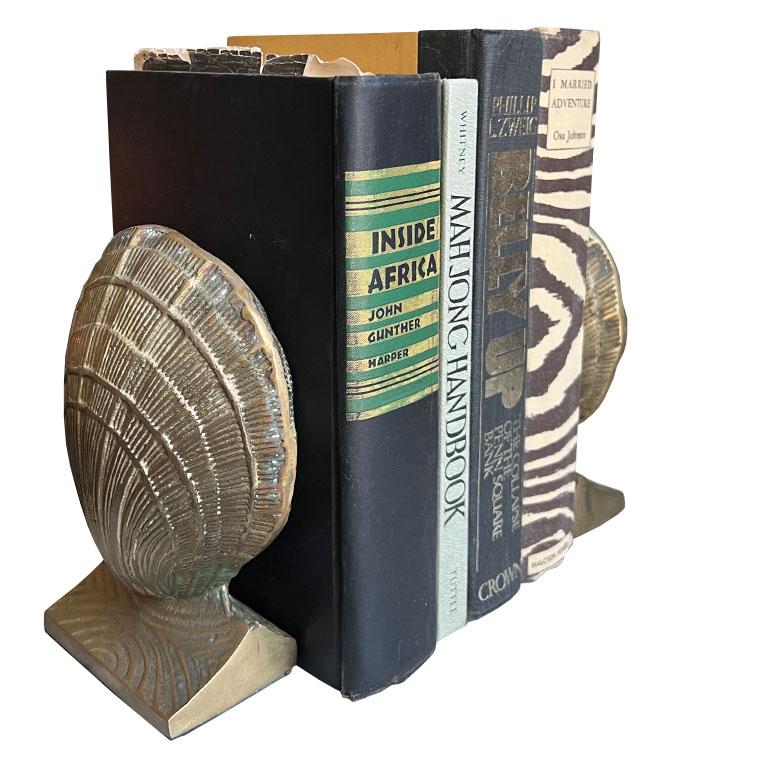 A pair of two solid brass clam shell bookends. This set would be wonderful on a desk, bookshelf or dressing table. 

Dimensions:
6.5
