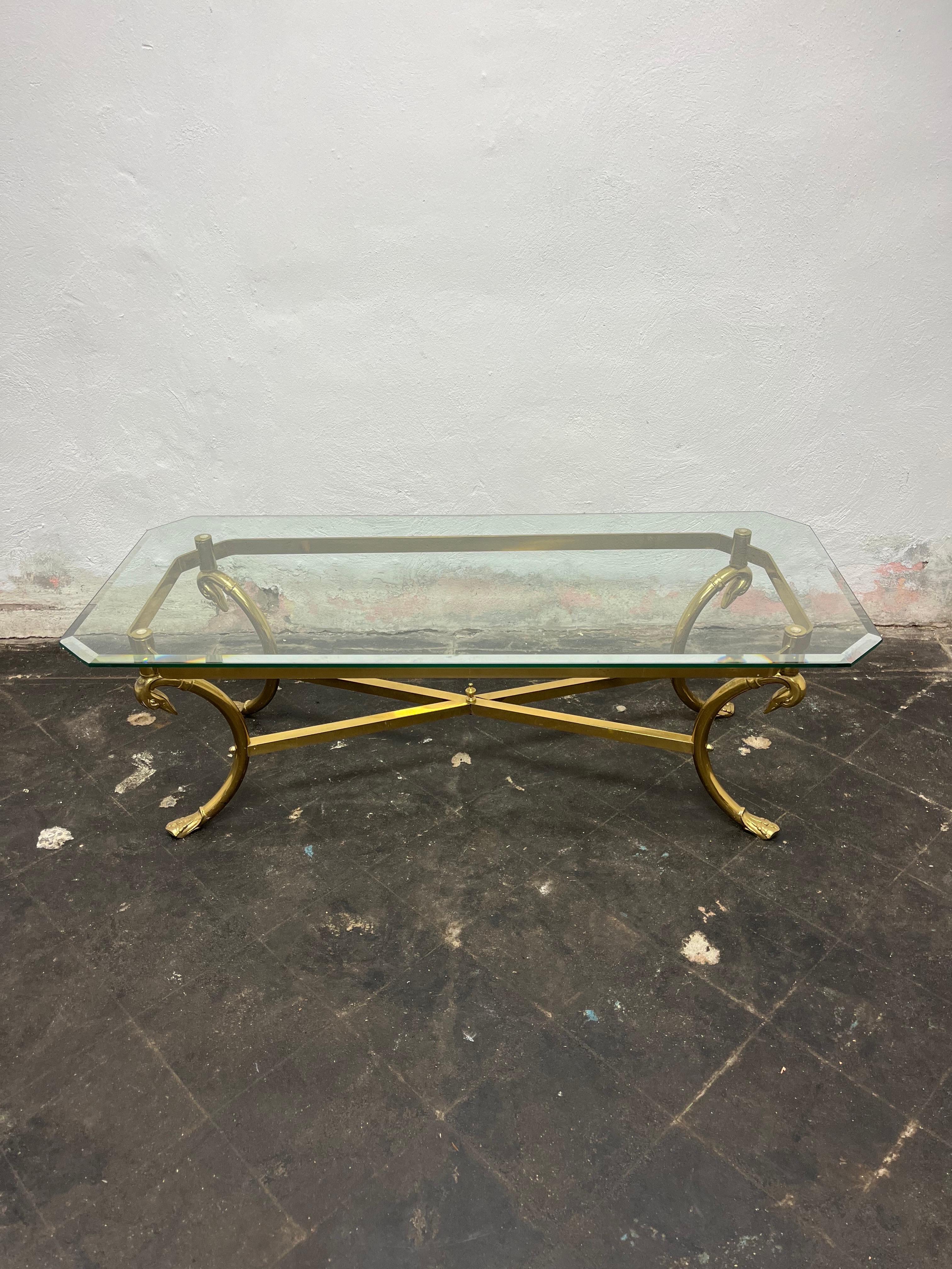 Classic brass swan base coffee table with beveled glass top in the manner of Maison Jansen. Beautiful swan design with web feet. Octagonal rectangular glass top with thick bevel.
Curbside to NYC/Philly $450