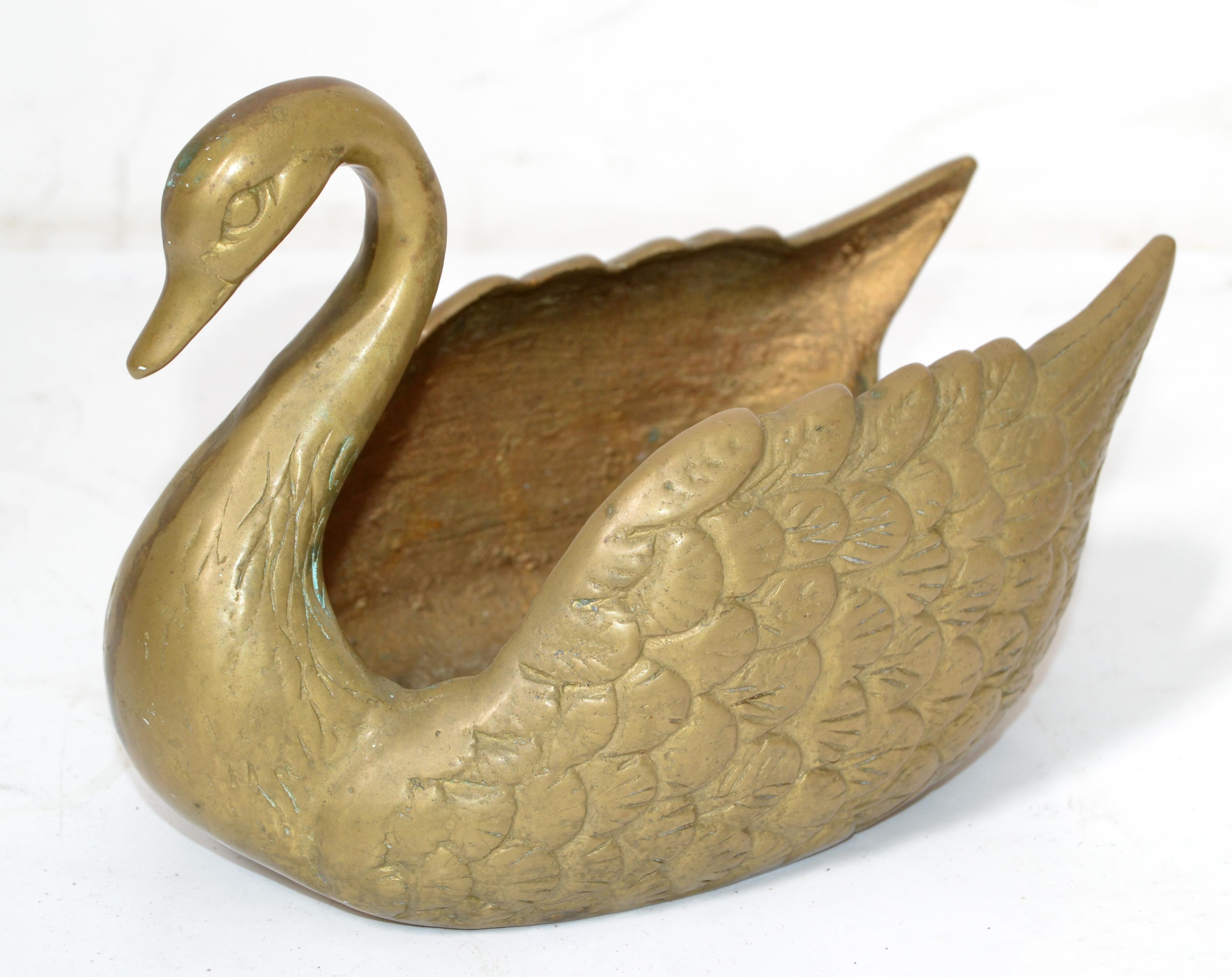 We offer a heavy Hollywood Regency solid cast bronze Swan planter, Animal Sculpture, Bowl or Centerpiece. 
Can be used indoors and also in your Patio-Porch area.
Gracefully crafted collector's piece.