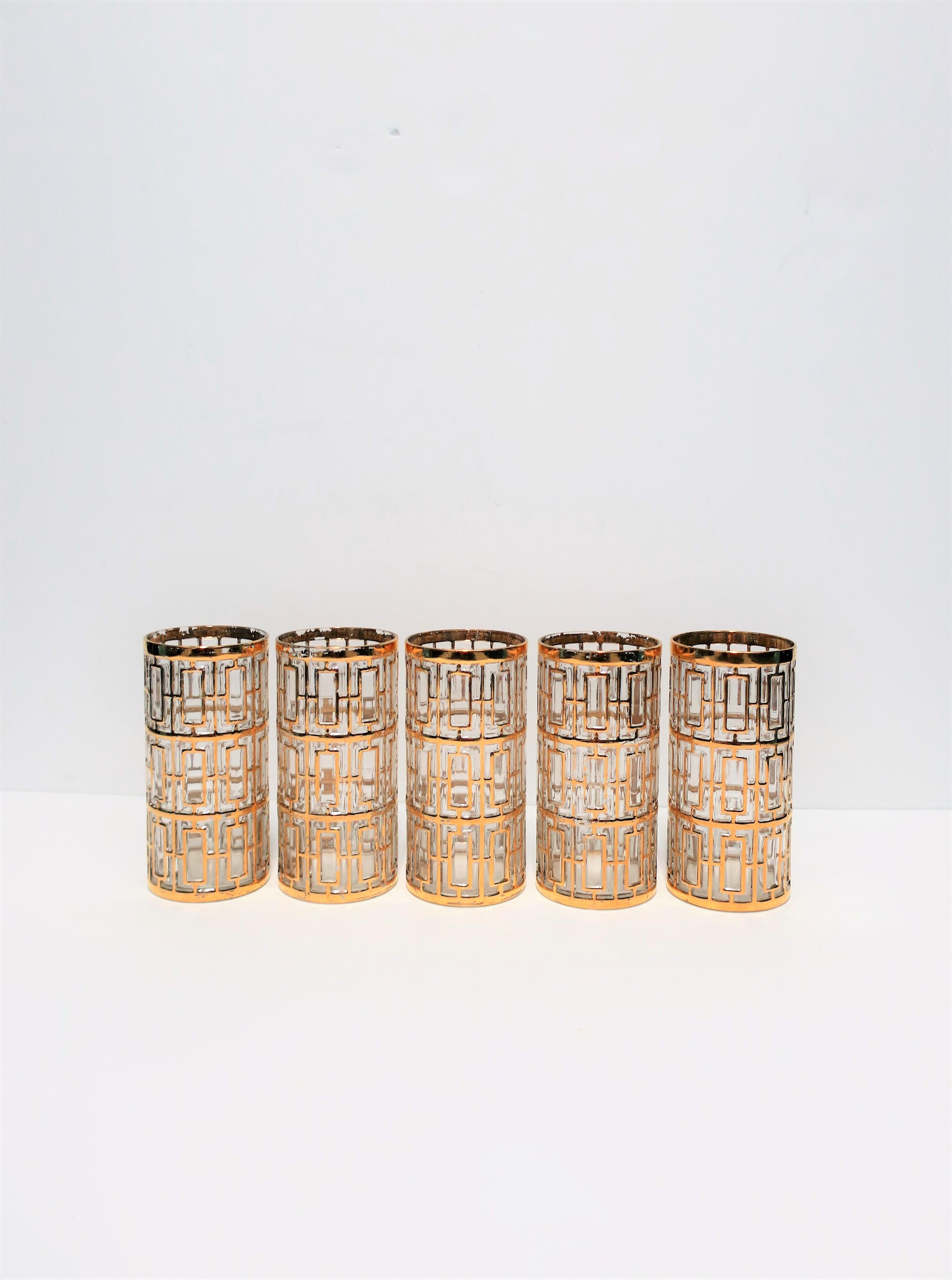 A beautiful and chic set of 5 vintage Hollywood Regency style highball cocktail glasses for your bar, bar cart, tray or entertaining area, circa 1960s, USA. Glasses have a 22-karat gold-plate overlay on clear glass in the 'Shoji' screen pattern,