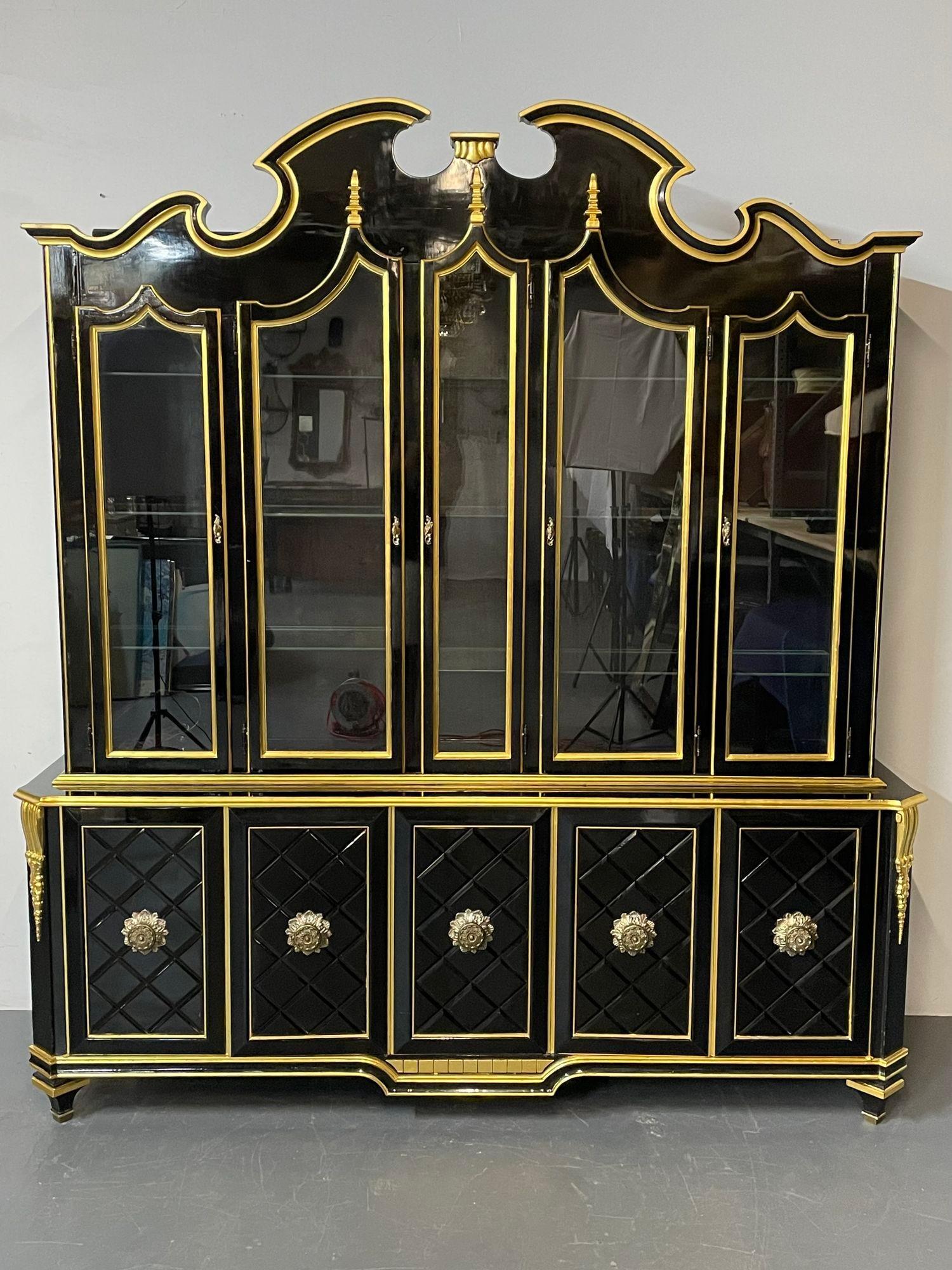 Large Hollywood Regency Style Bookcase / China Cabinet, Maison Jansen Inspired copied by Grosfeld House.
A Grand Hollywood Regency style ebonized and gold parcel-gilt breakfront or bookcase, Dish cabinet having a molded top over a conforming cabinet