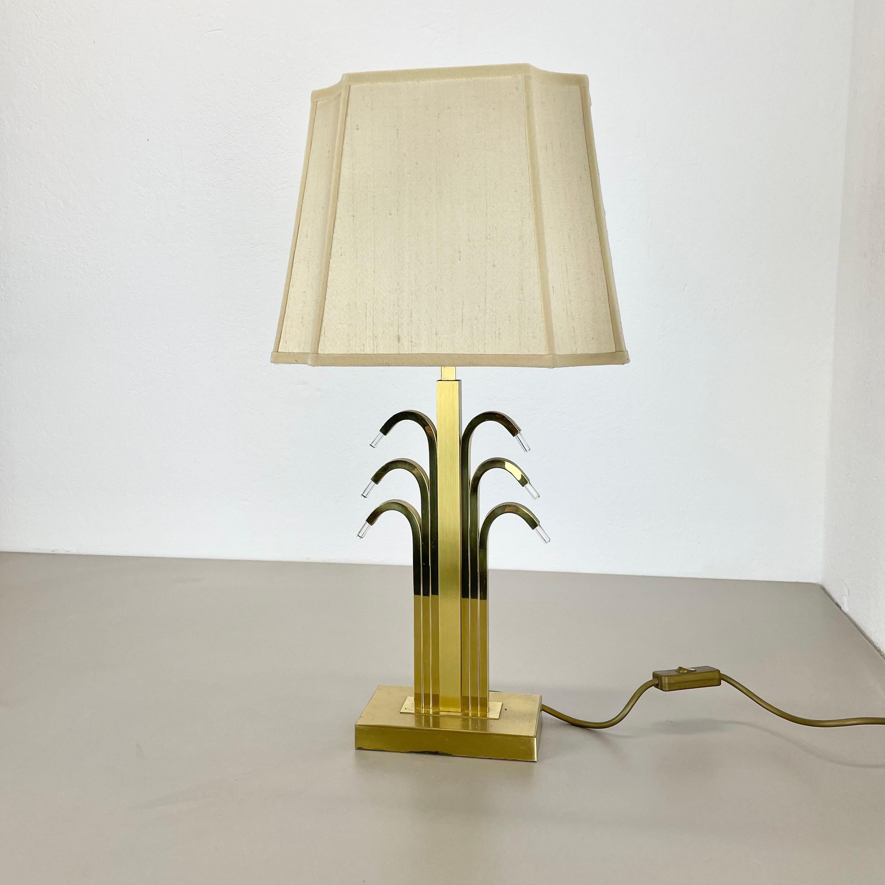 Article:

modernist brass table light base


Origin:

Germany


Decade:

1970s



This original vintage light was designed and produced in the 1970s in Germany by WKR LIGHTS.. The light is made of brass and and plexiglass elements on the sides,