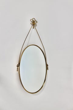 Hollywood Regency Style Brass Oval Bow Tie Tassel Wall Mirror Italy 1970s