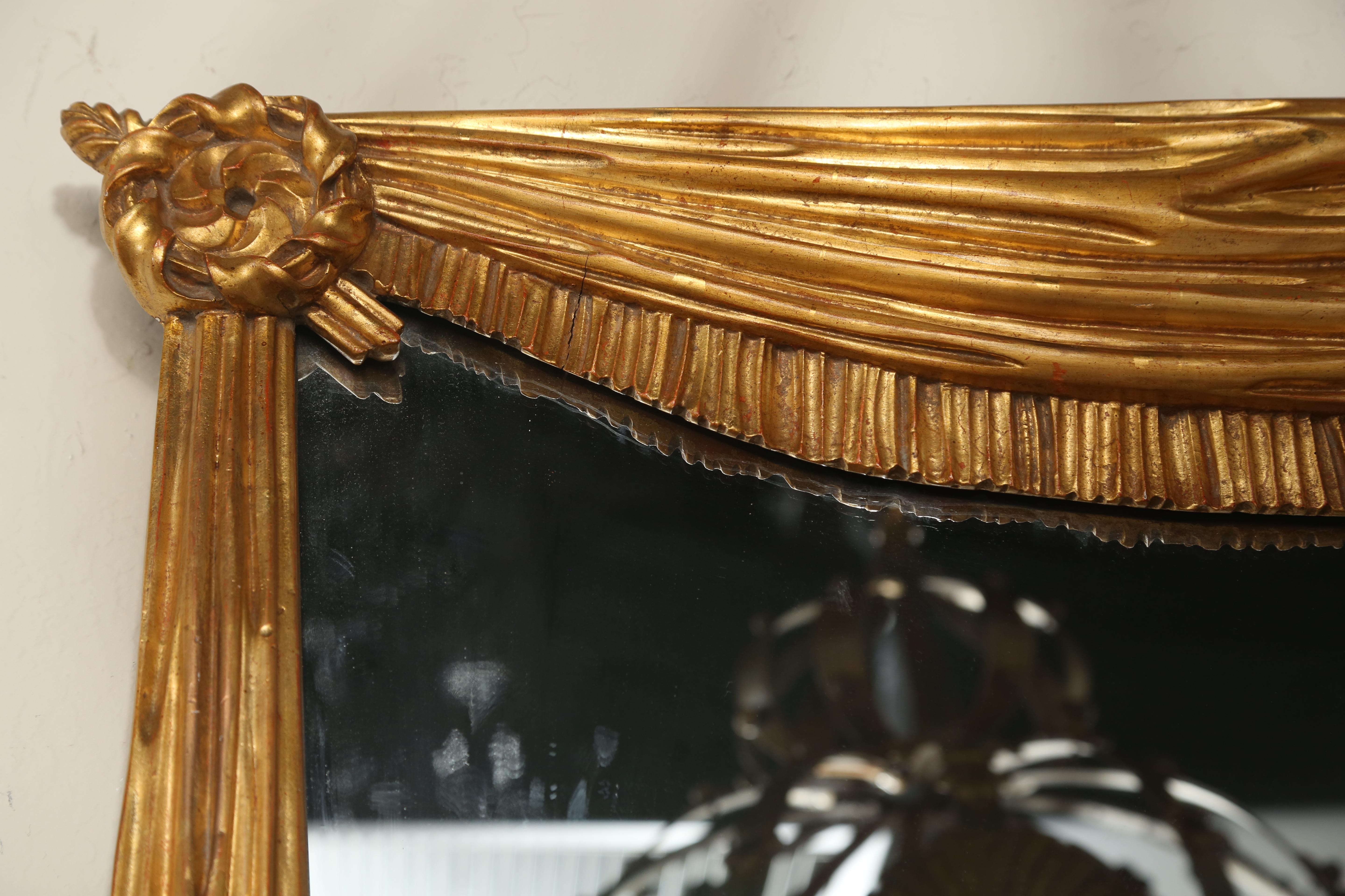 Hollywood Regency Style Carved and Gilded Swag Mirror In Good Condition In West Palm Beach, FL