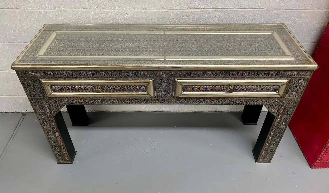 Hollywood Regency Style Console, Desk or Table Silvered in Filigree Design
Featuring amazingly intricate latticework on silver-toned brass with natural multi-color natural stones decorative ornate, the console brings a refined, aristocratic ambiance
