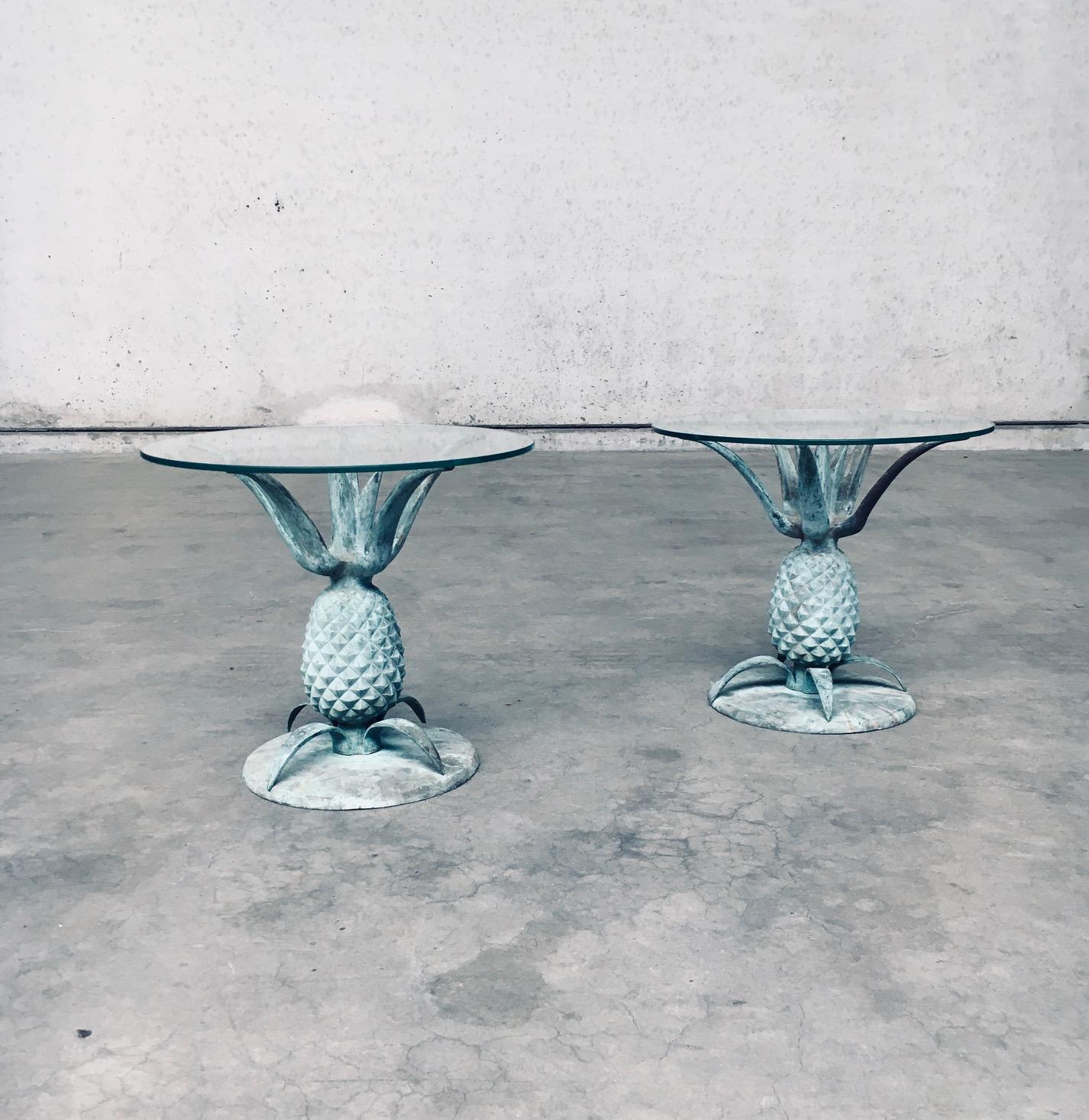 Vintage French Hollywood Regency Style Design Solid Brass & Glass Pineapple Side Table set of 2. Made in France, 1970's period. In the style of Hans Kögl designs. Solid brass casted and patinated pineapple base with round glass top. These come in