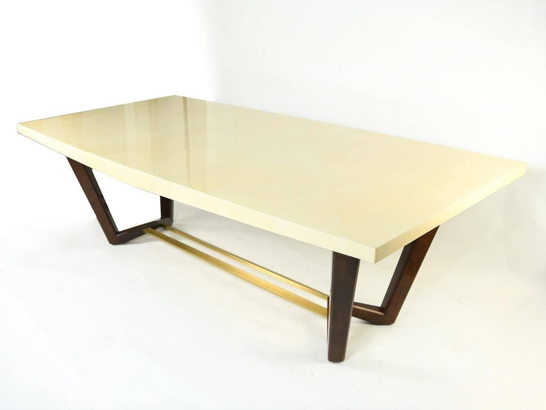 Lorin Marsh Design Sawhorse dining table or conference table. Shown here in a bleached parchment and mahogany base with brushed-brass stretcher. This stunning dining, center or conference table is sure to add sparkle to any room in the home or