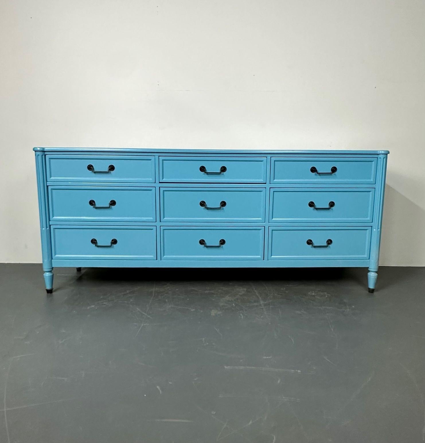 Hollywood Regency style dresser / sideboard, cerulean blue lacquer, brass accents, recently painted in our state of the art workshops.

Baker nine drawer chest painted in Cerulean Blu with black brass handle drawer pulls. the case with coffered