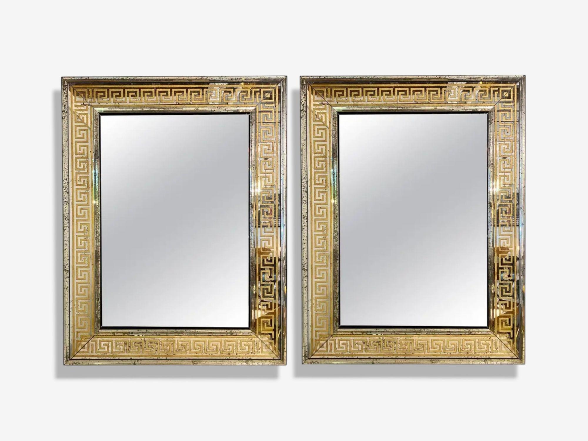 Hollywood Regency Style, Etched Glass, Gilt, Greek Key Motif, Large Wall Mirrors, USA, 21st c

Pair of modern Hollywood Regency style gilt gold rectangular mirrors featuring a Greek key motif and distressed glass beveled mirror border. The wooden