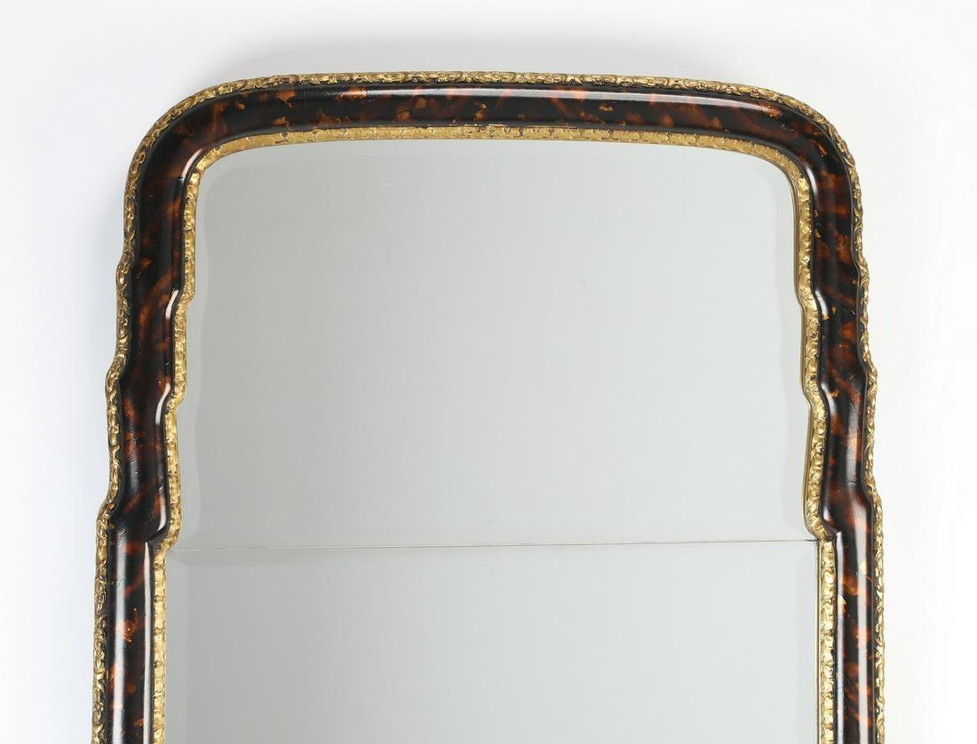 Hollywood Regency style faux tortoiseshell and gilt decorated wall or console beveled mirror.


ZhS.
  