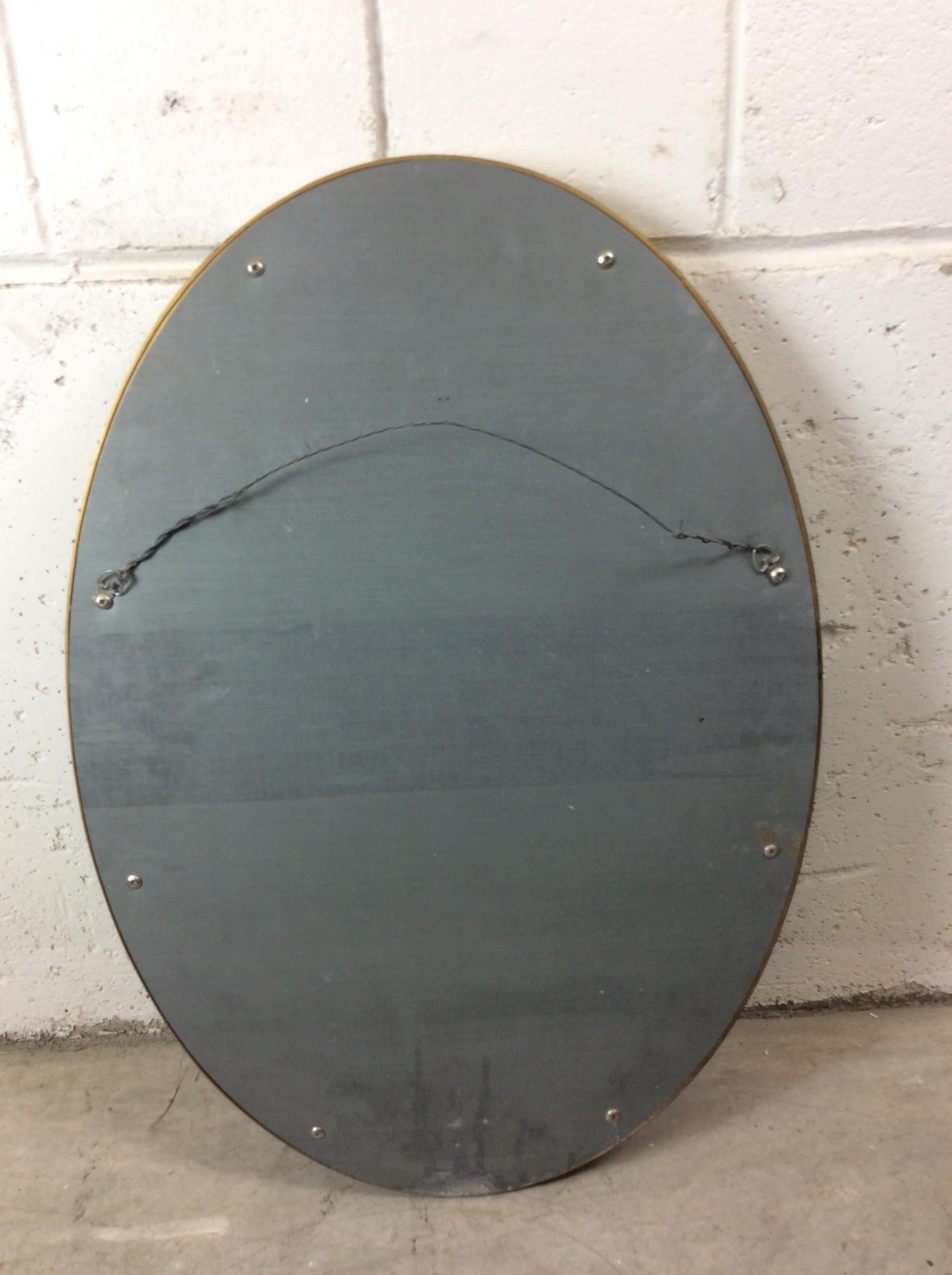 Hollywood Regency Style Floral Oval Gold Framed Wall Mirror In Good Condition For Sale In Amherst, NH