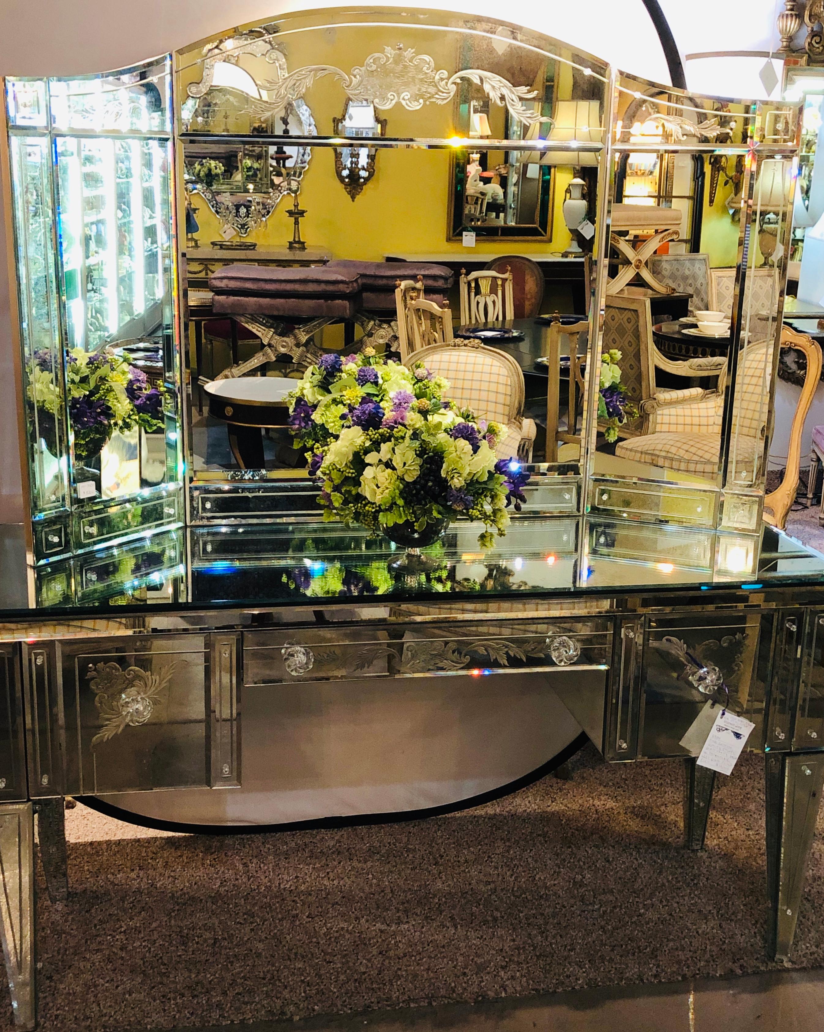 A Hollywood Regency style gilt etched glass tri-fold large vanity or desk mirror. This mirror comes with a large and highly impressive vanity desk that is sold separately. The custom quality finely designed tri fold mirror has two folding sides that