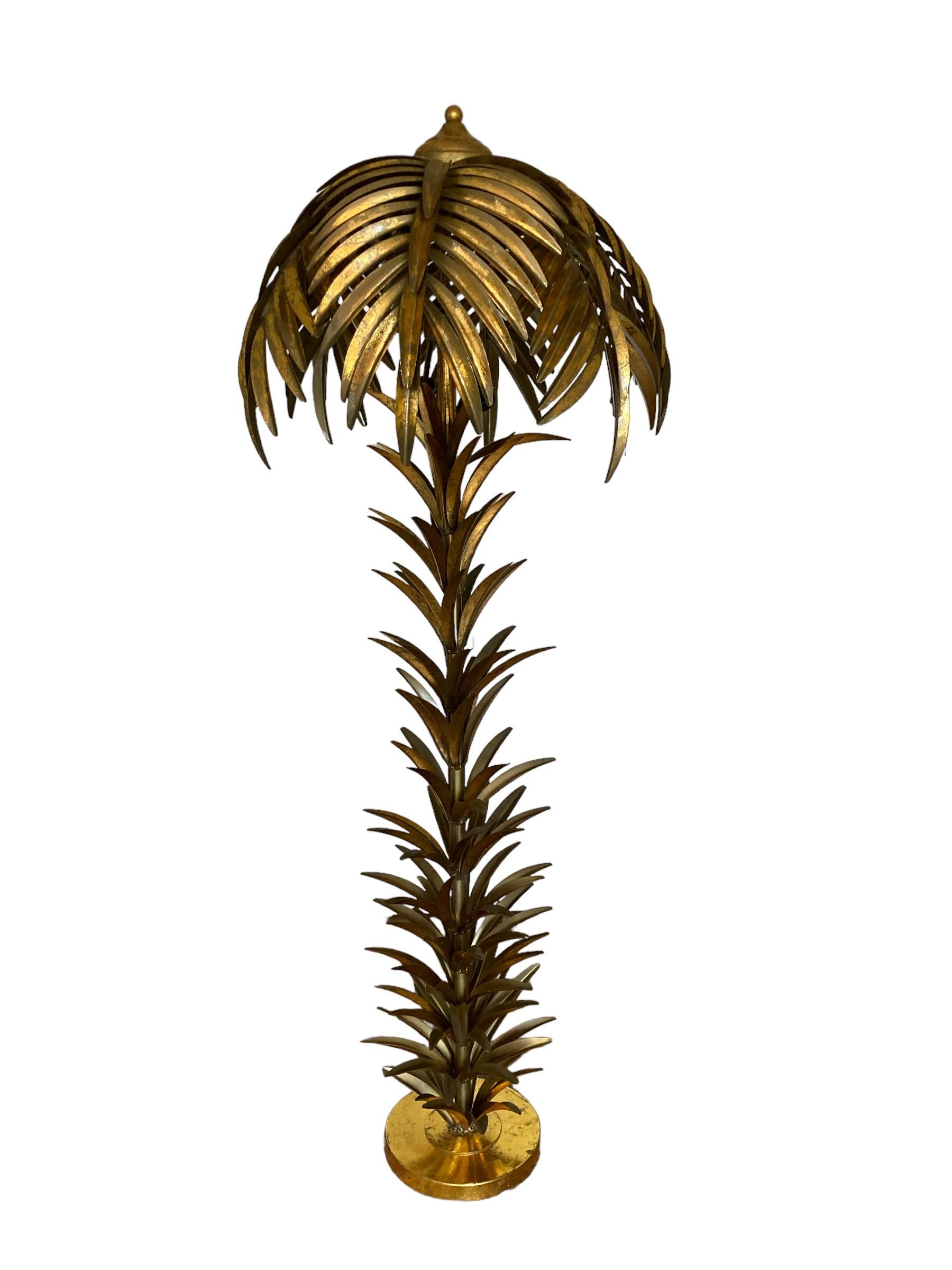 Hollywood Regency Style Gilt Metal Palm Tree Floor Lamp, Mid to late 20th Century. This tall floor lamp has amazing presence in any room and style of interior design. A rare floor lamp in this design and with an essence of Vivai Del Sud with the