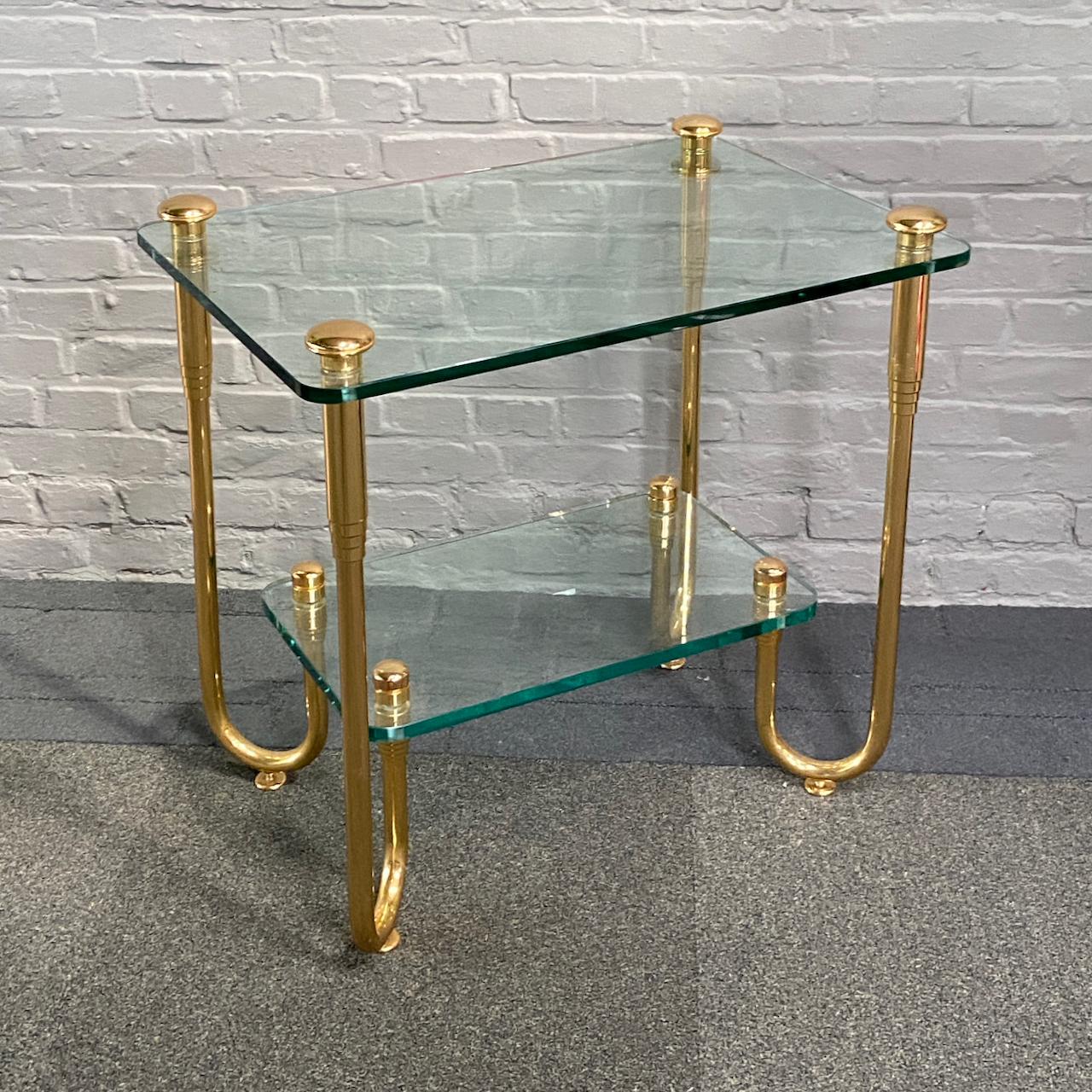 Hand-Crafted Hollywood Regency style gold plated glass side table For Sale
