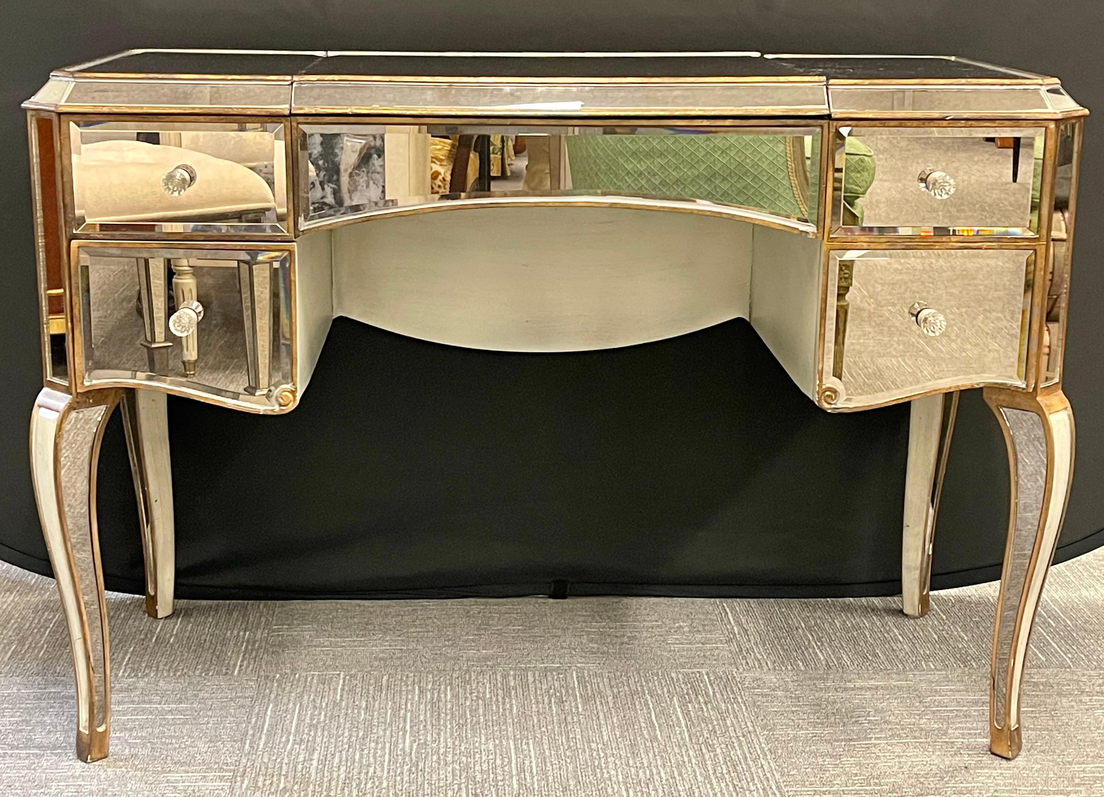 Hollywood Regency style Mirrored Vanity with bench. Finely crafted vanity desk having all beveled mirror inserts with a fitted interior and a flip up make up mirror. Dimensions -31