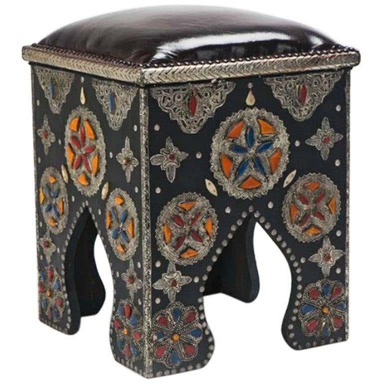 Hollywood Regency style Moroccan ottoman or stool with leather top, a pair
This elegant pair of handmade Moroccan ottomans or stools in a Hollywood Regency style impresses with its multicolored inlaid bones, handcrafted designs and Moorish arches.