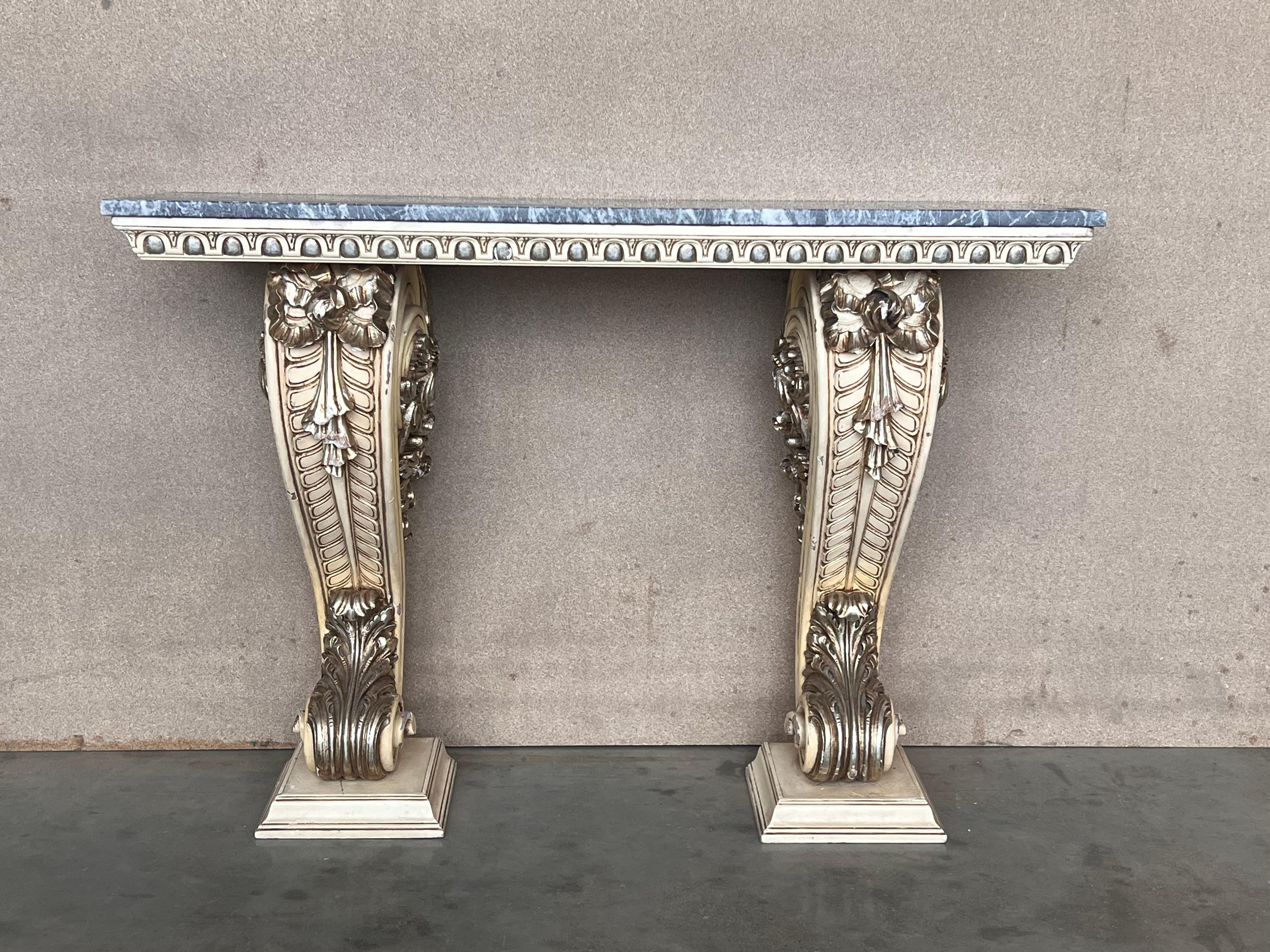 Dramatic Hollywood Regency Palm Leaf console lacquered in eye catching almond latte lacquer with a beveled edge marble top. French Riviera inspired elegance. Glamorous. Gregarious.  Palm leaf pillars emanate from a platform base like fountains. The