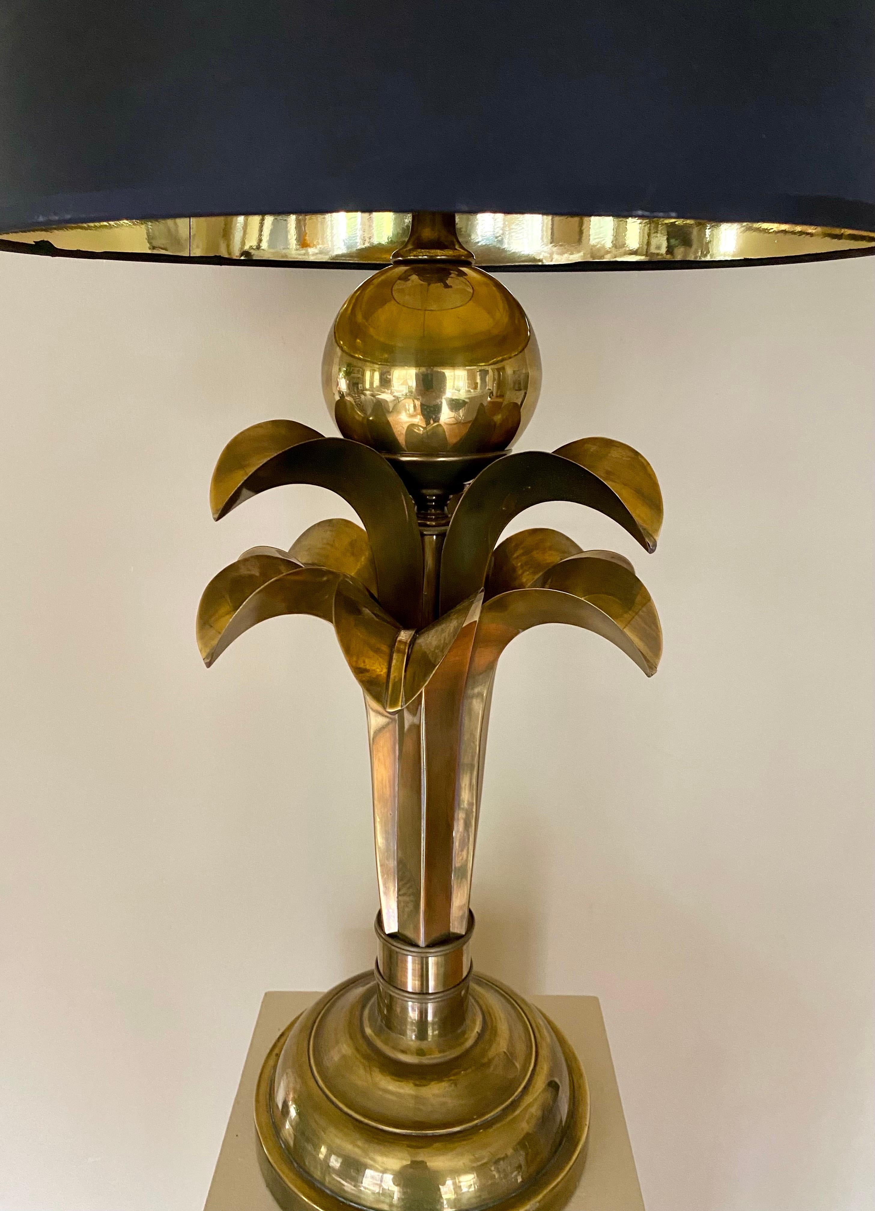 Fabulous Art Deco style palm tree form table lamp by Hart Associates, circa 1970's.  This warm aged patinated brass metal lamp features a stylized bamboo stem, sculptural palm leaves, and a large reflective center sphere.  Lamp shade no included. 