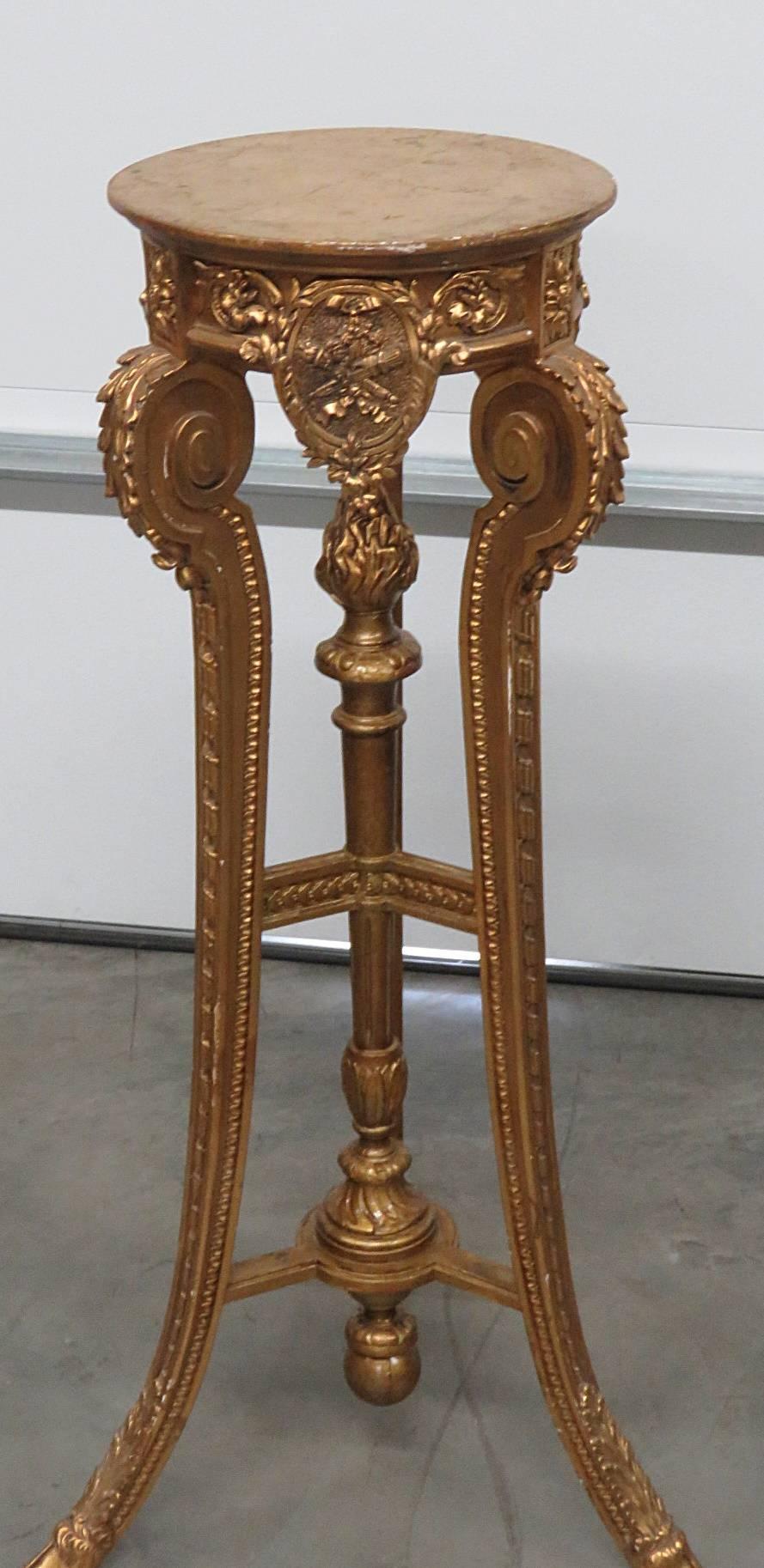 Hollywood Regency style carved giltwood pedestal.