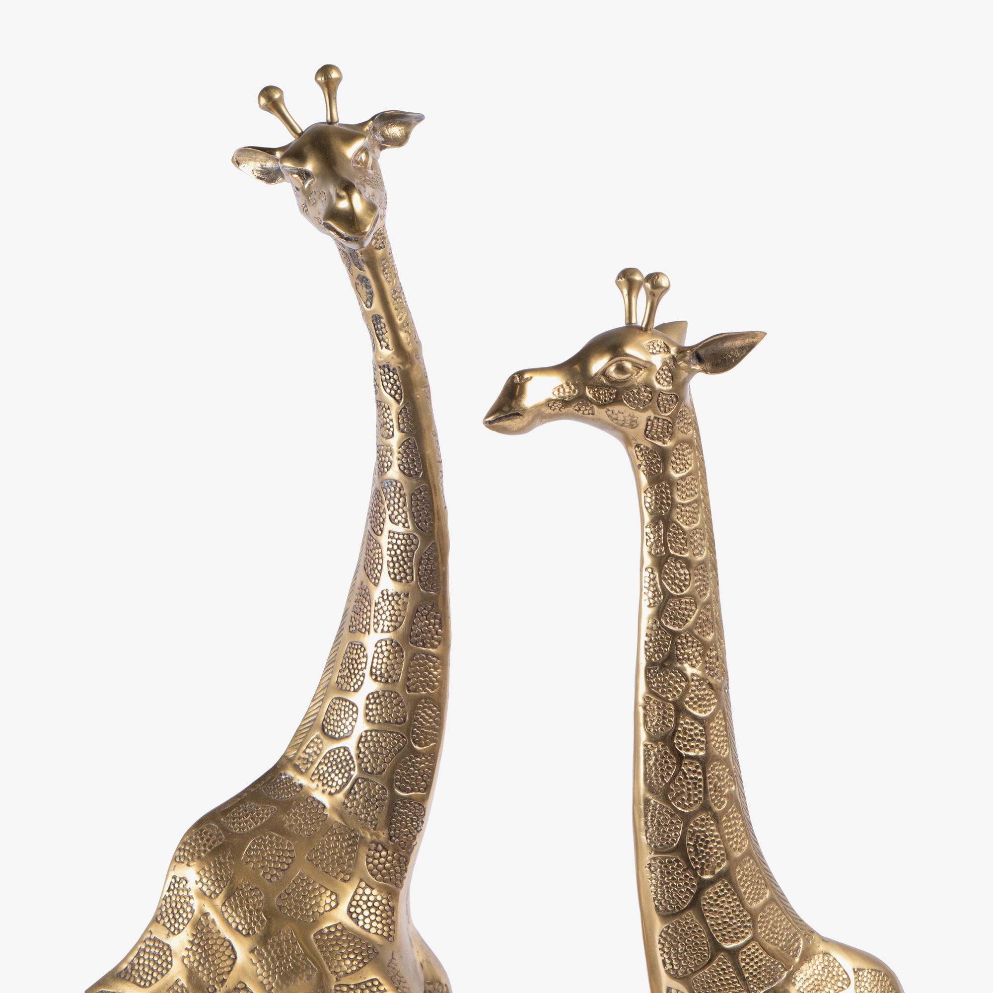 Ottone Sculture di giraffa in ottone lucido in stile Hollywood Regency, coppia in vendita