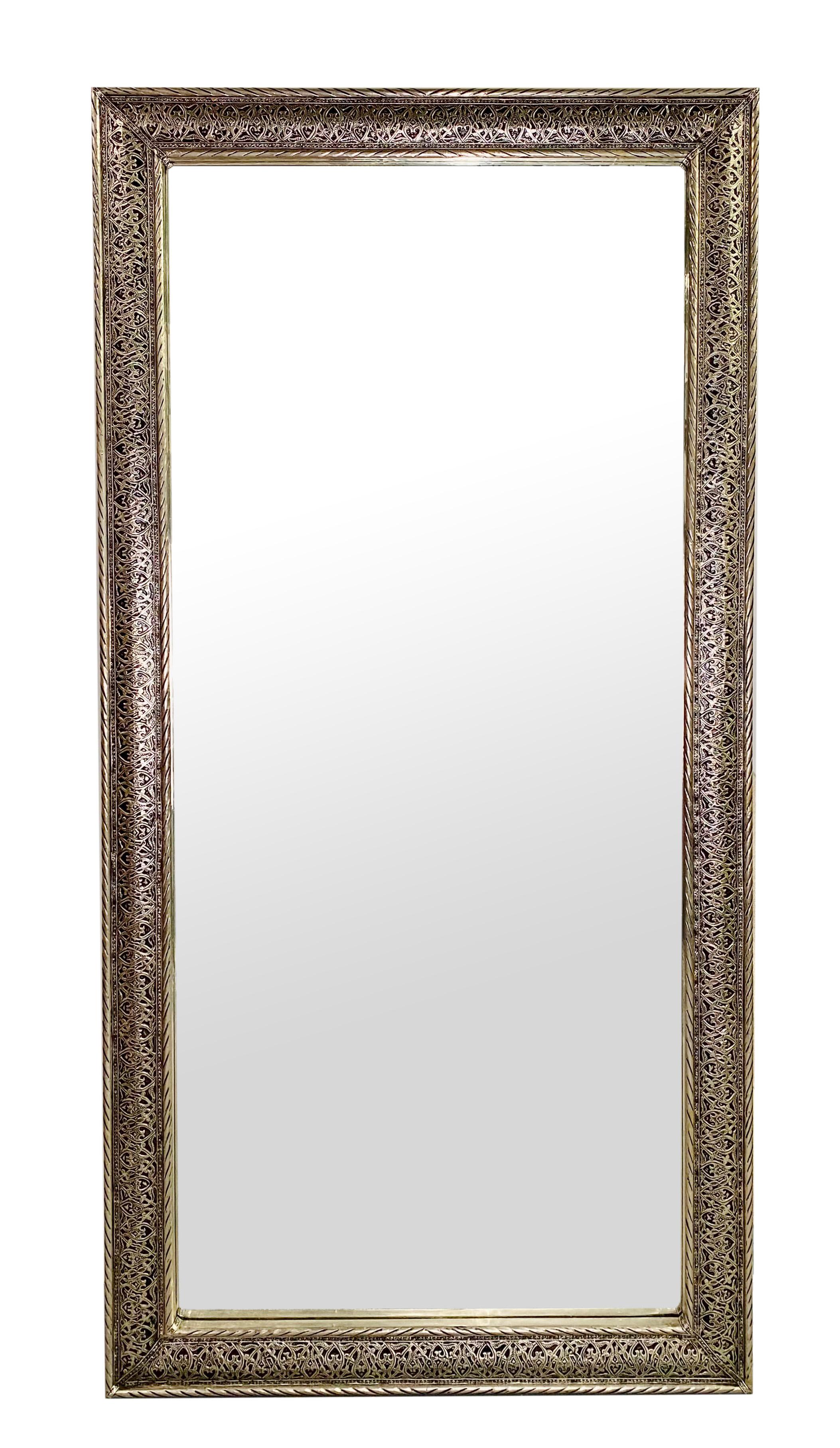 A pair of Hollywood Regency style large mirrors. The mirrors' frame is finely handmade in beautiful filigree design using the best of quality silvered brass material. The mirrors can be displayed as wall mirrors, floor mirrors and both horizontal