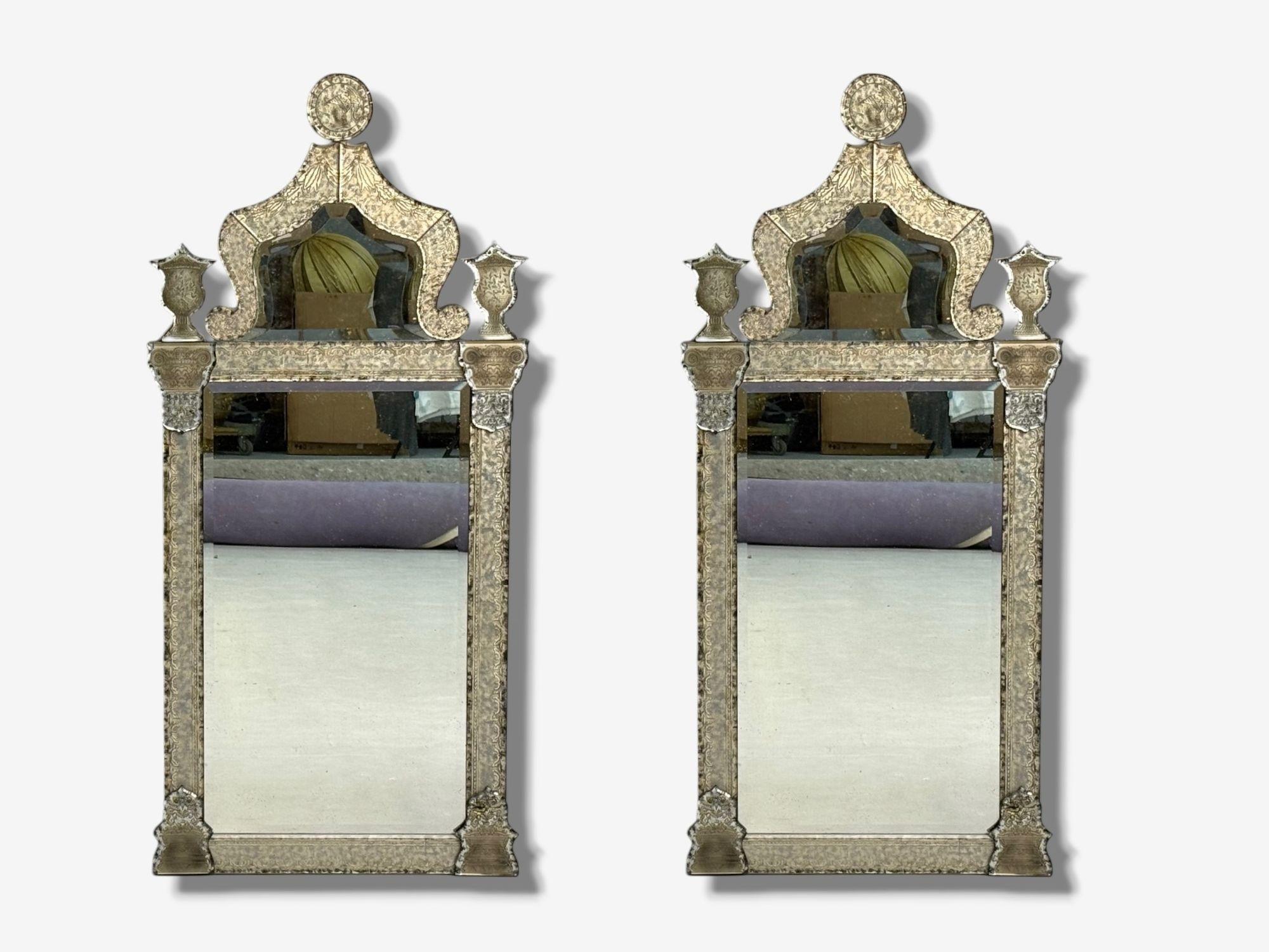 Hollywood Regency Style, Silver Leaf, Etched Glass, Venetian Wall, Console, or Pier Mirrors, 21st c.

Pair of venetian mirrors each having 15 individual etched glass panels depicting architectural motifs with silver leaf backings. The two most