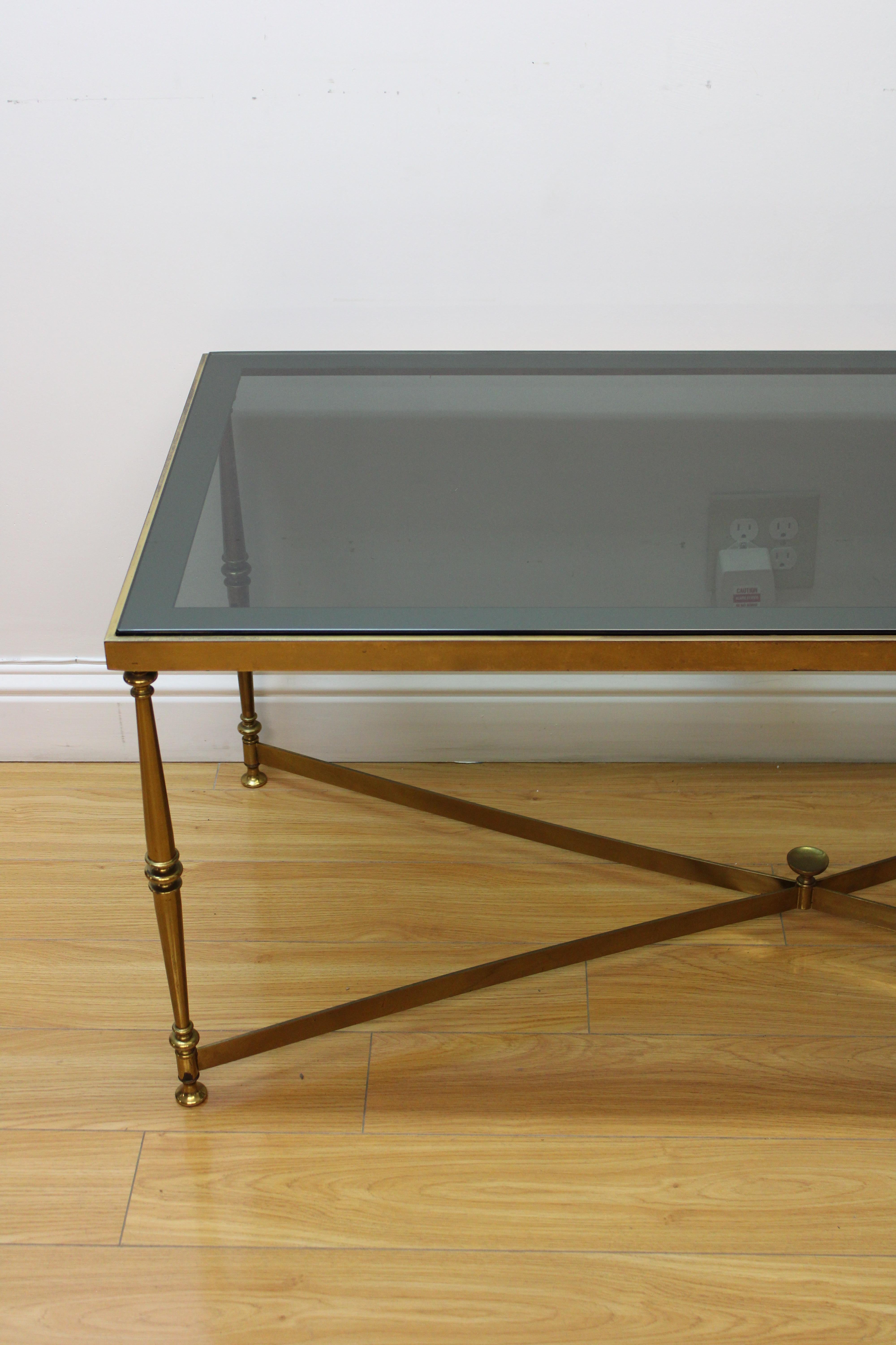 C. 20th Century

Hollywood Regency Style Smokey Glass Top Table w/ Brass Base.