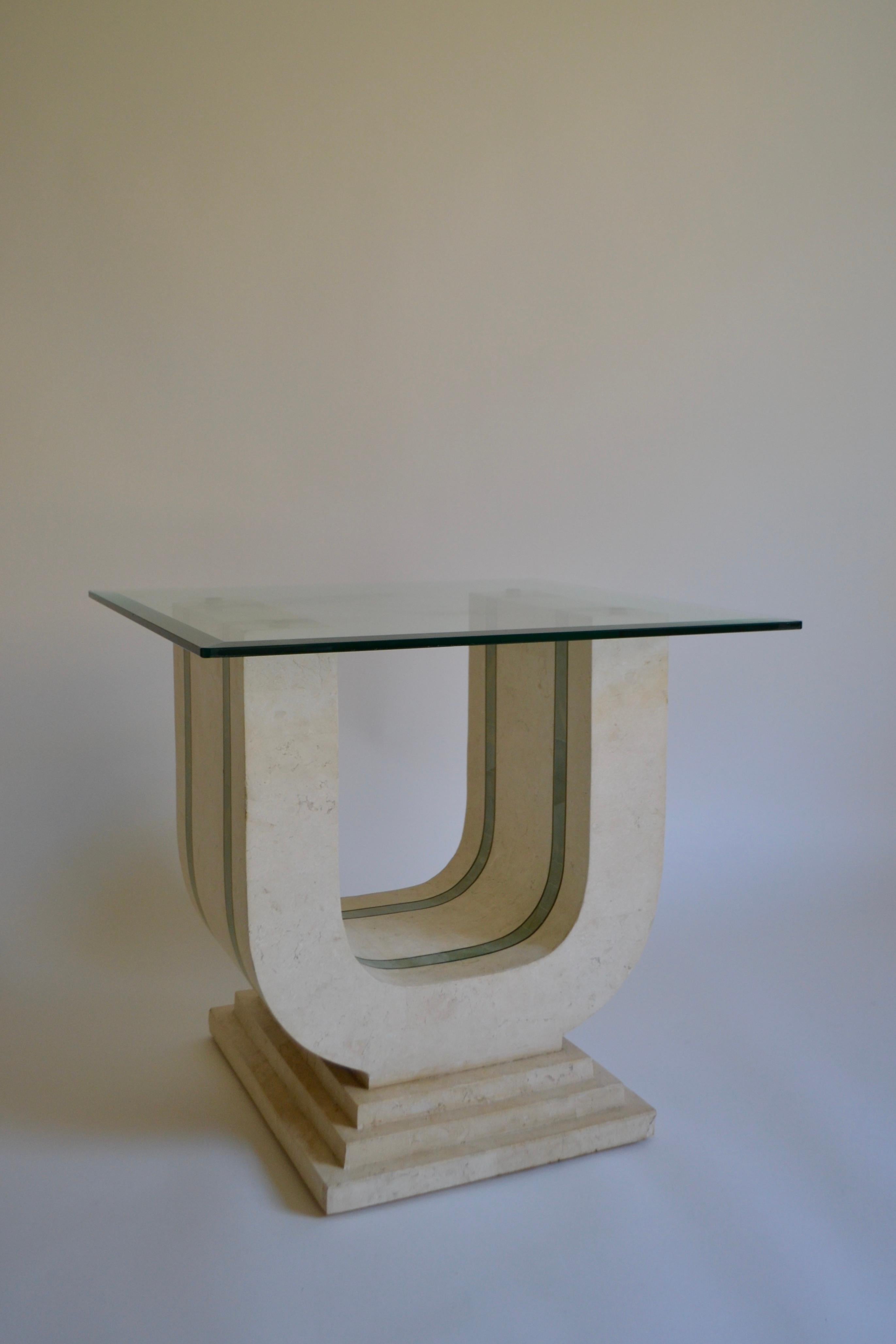 A tessellated stone coffee / occasional table with square glass top designed by Maitland Smith in the Hollywood Regency style, in the 1980s. Small chips to stone as pictured.