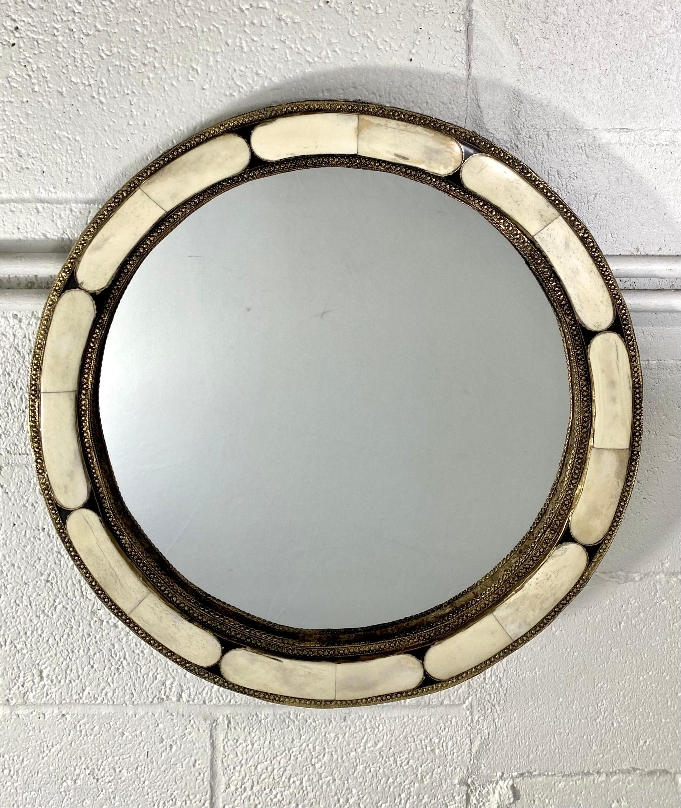 A stylish pair of White Round Mirrors in Hollywood Regency Style. Handcrafted with bone and brass inlay and featuring beautiful design elements, this exquisite pair of mirrors brings a sense of robust elegance to any space.

Dimensions: 20