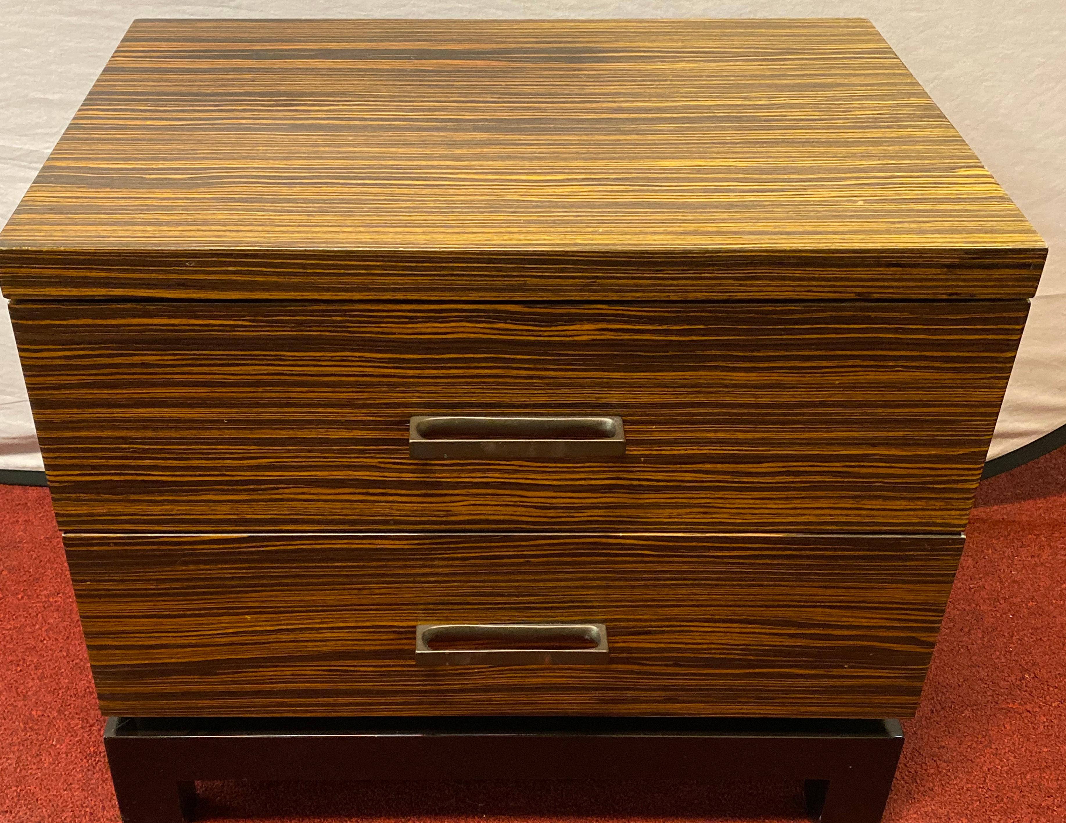 Hollywood Regency style zebra wood end tables / night stands or chests. A pair of finely constructed bedside stands, end tables or chests. Purchased directly from an estate in NYC we are told that these were Nancy Corzine chests purchased directly