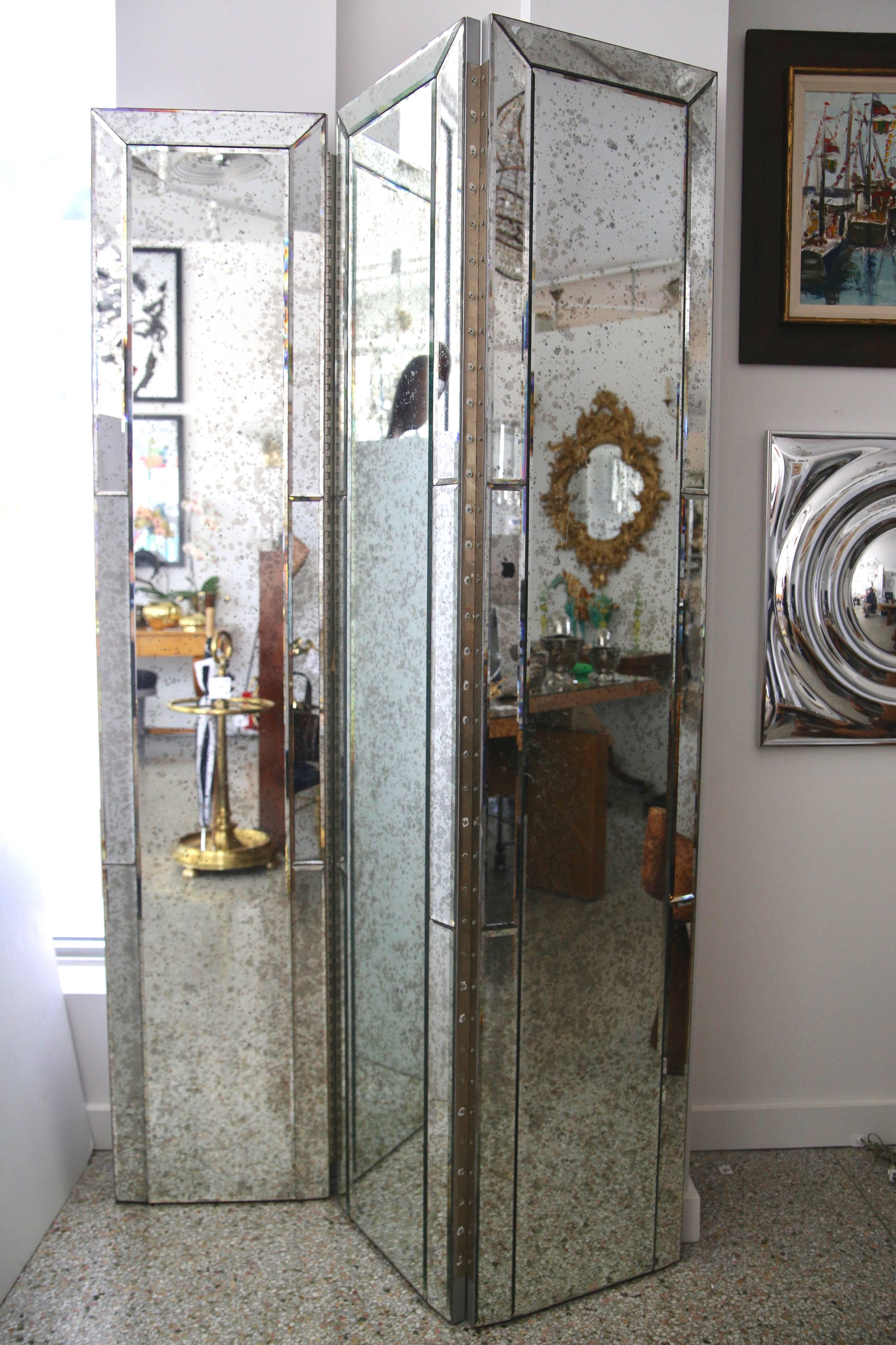 This stylish three-panel mirror will make the perfect divider or backdrop for your home with its antiqued mirror panels all detailed with a beveled edge.

Note:  Each section measure 16