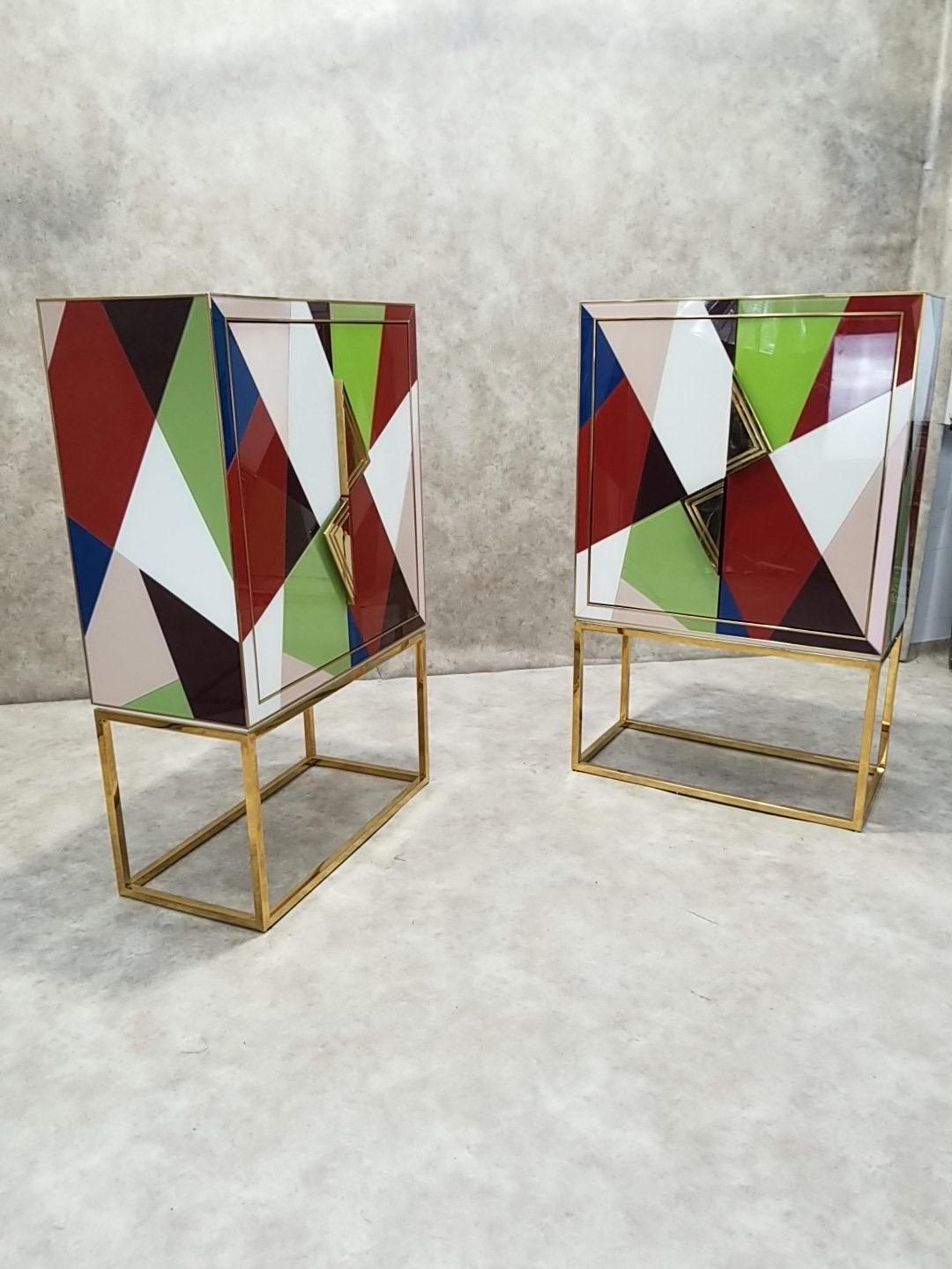 Hollywood Regency Styled Torino Reverse-Painted Glass and Brass 2 Door Dry Bar Cabinet by Jonathan Adler - Set of 2

“Bring a set of unique, rich and moody Milan moments into your life with our new Torino collection’s signature palette. Featuring