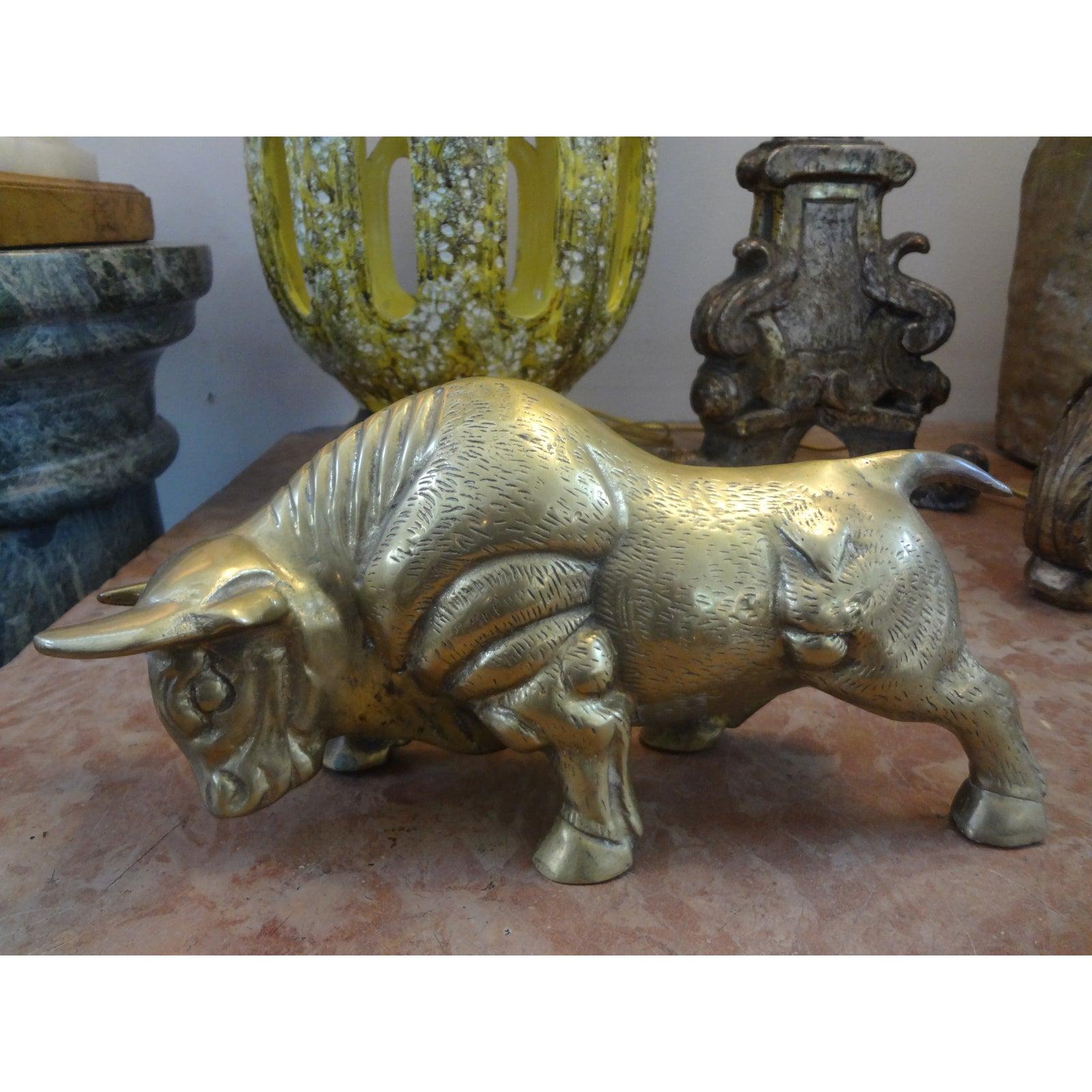 Well Cast mid-century cast brass bull figure or statue. This beautifully detailed Hollywood Regency stylized brass bull sculpture would look great on a tabletop or in a bookcase.