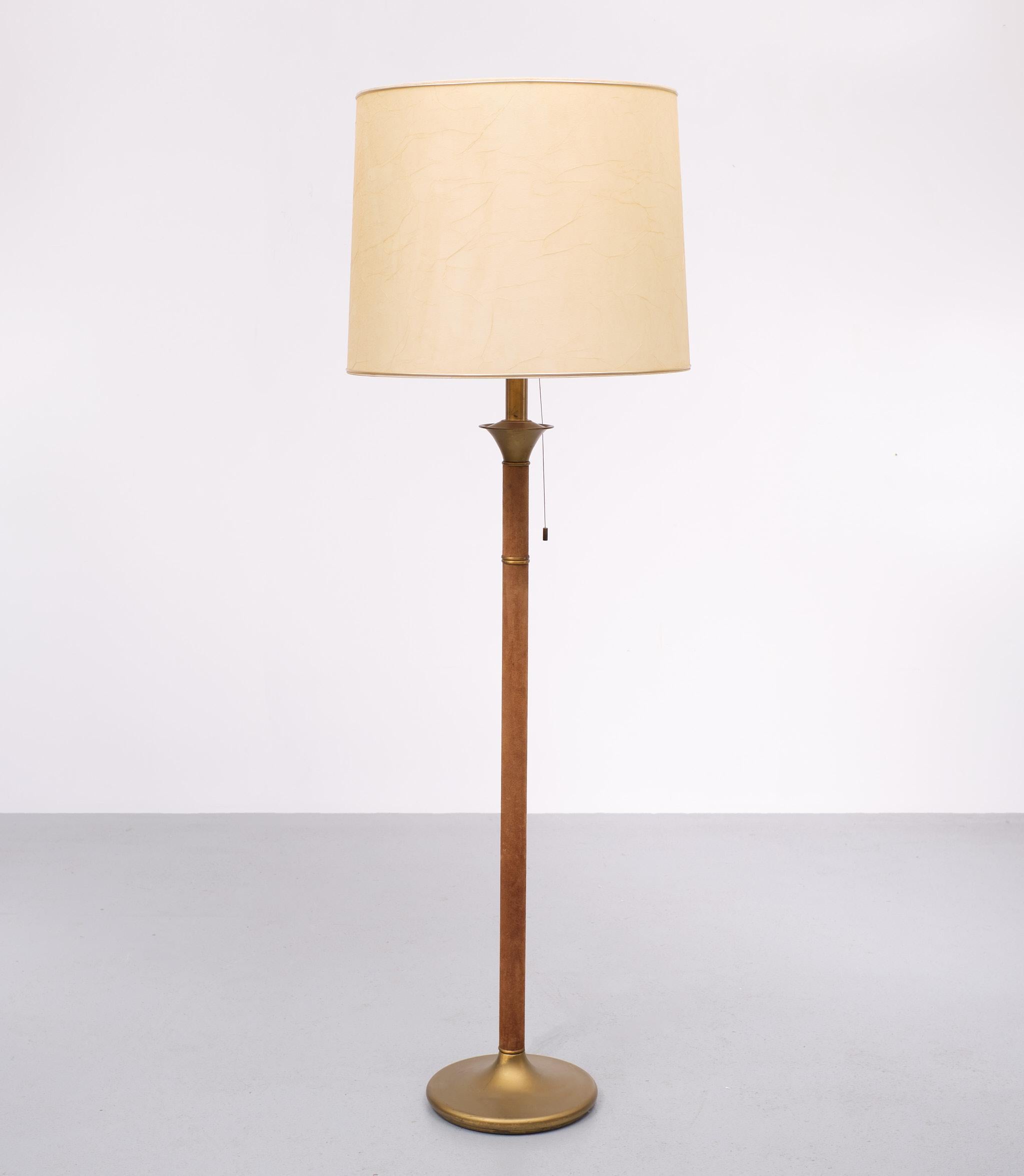 Very nice Hollywood Regency floor lamp covert with Suede ,Brass base and top . Three large bulbs needed E27 . pull down switch .comes with its original shade . just the right amount 
of Patine . . 