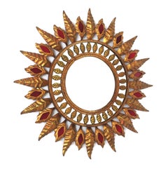 Hollywood Regency Sunburst Mirror in Gilt Metal and Red Glass Detail, 1950s