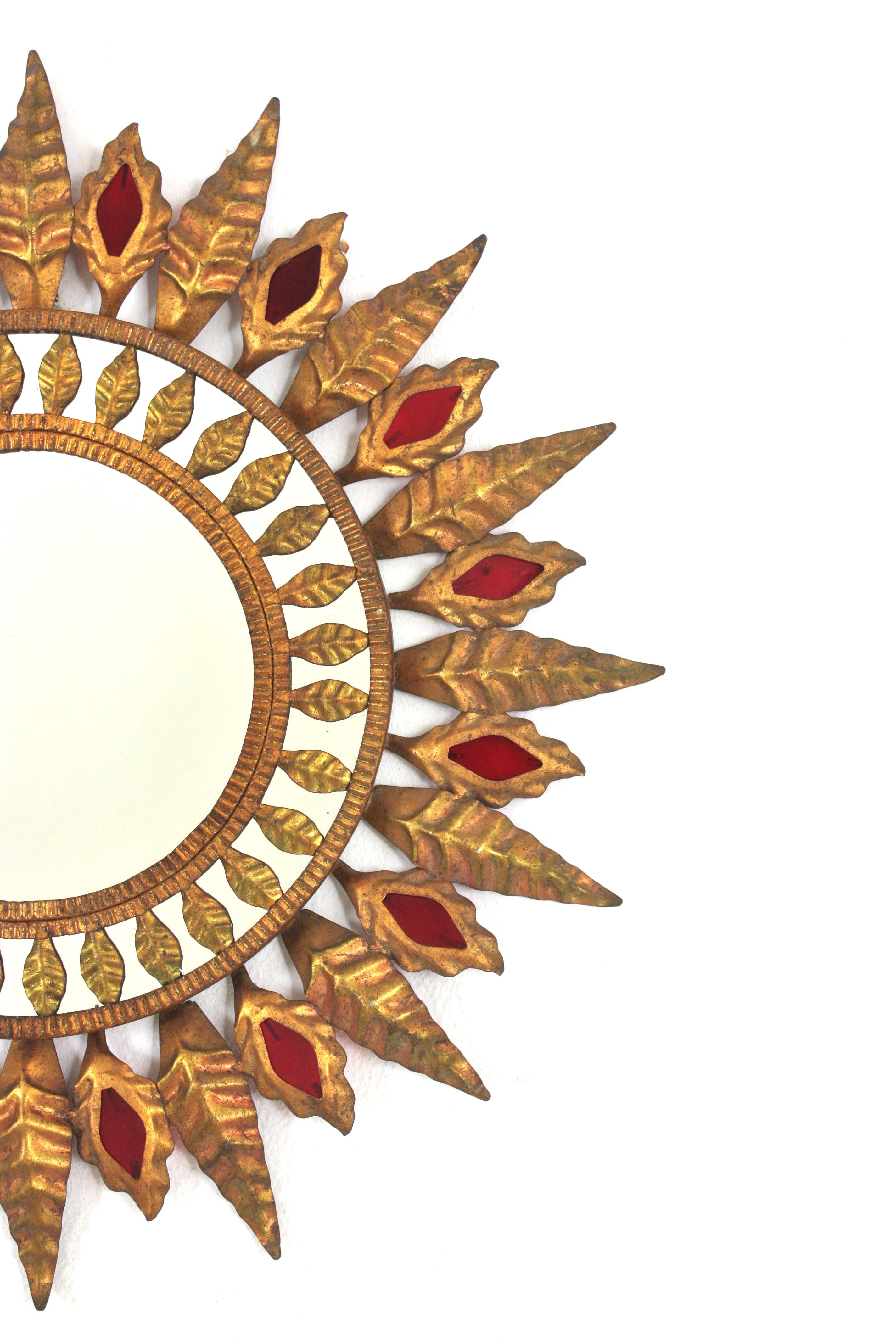 Hollywood Regency Sunburst Mirror in Gilt Metal and Red Glass Detail, 1950s For Sale 1