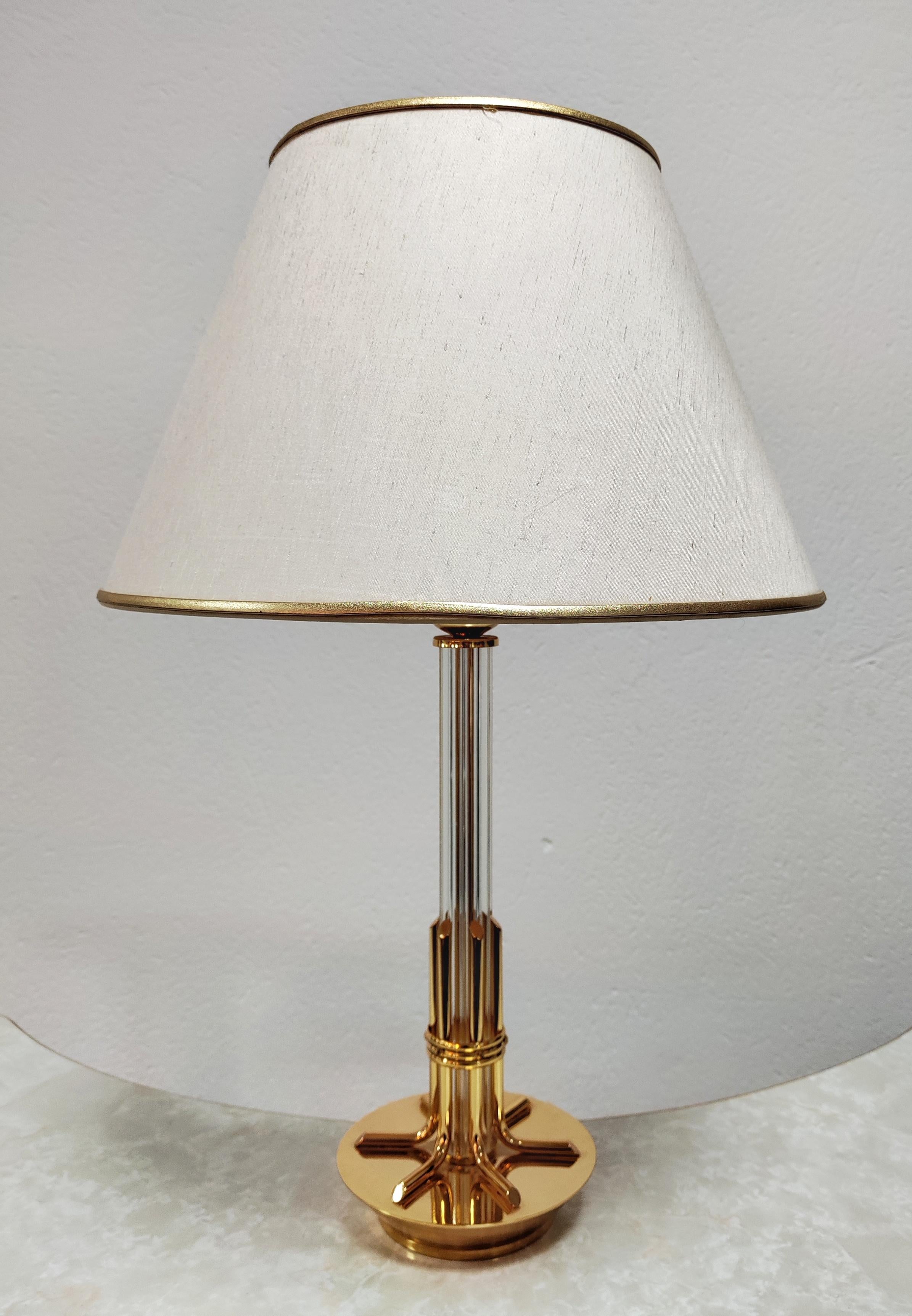 In this listing you will find a very elegant Hollywood Regency table lamp by Solken Leuchten. It features beautiful stand done in combination of lucite and brass and a wide shade. Made in West Germany in 1970s.

Lamp is in good vintage condition