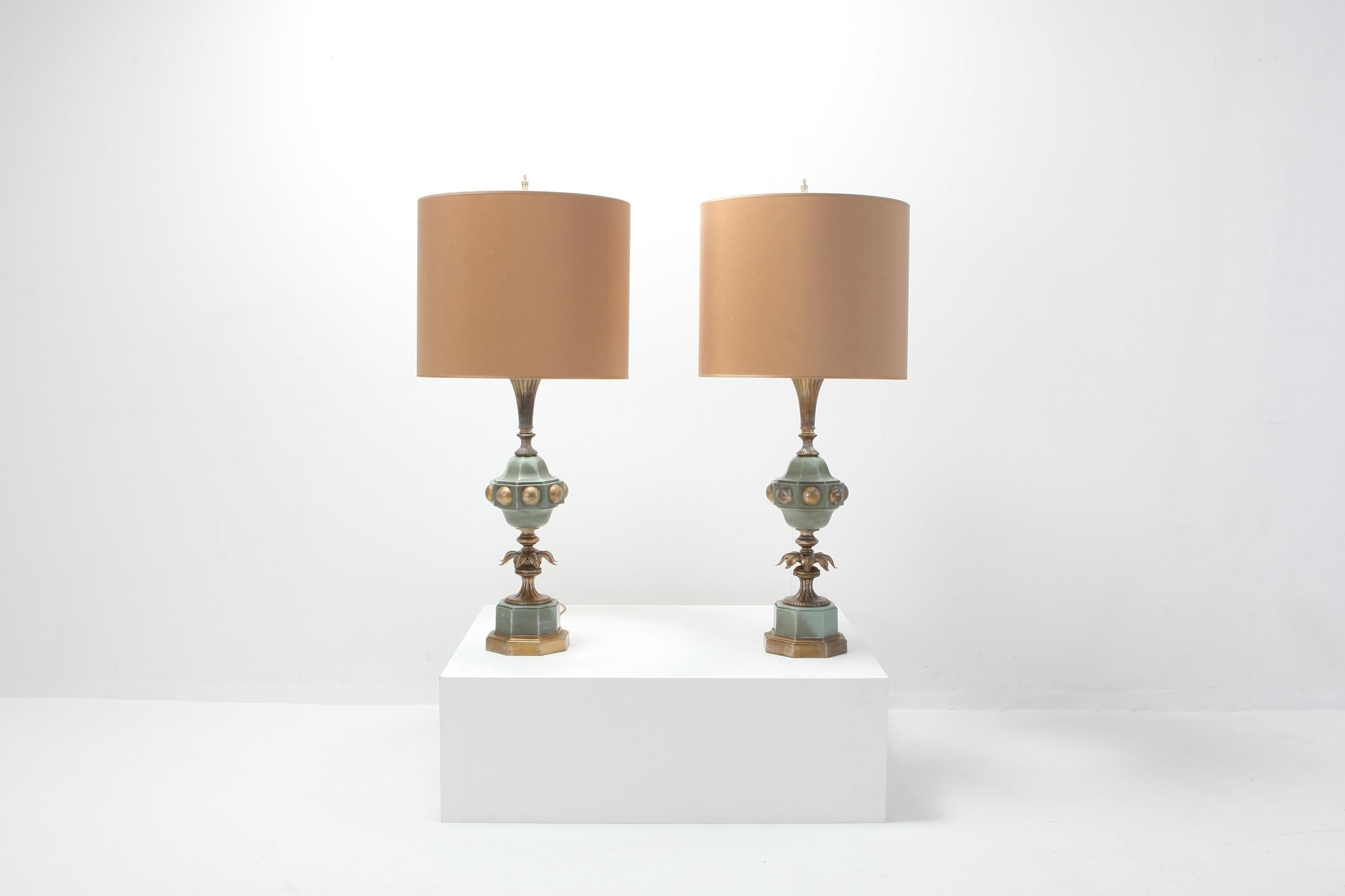 Brass pair of tall regency table lamps.

The gorgeous carved wooden bases with gold cream coloured shades hold an amazing patina. 

A true regency set. 



 