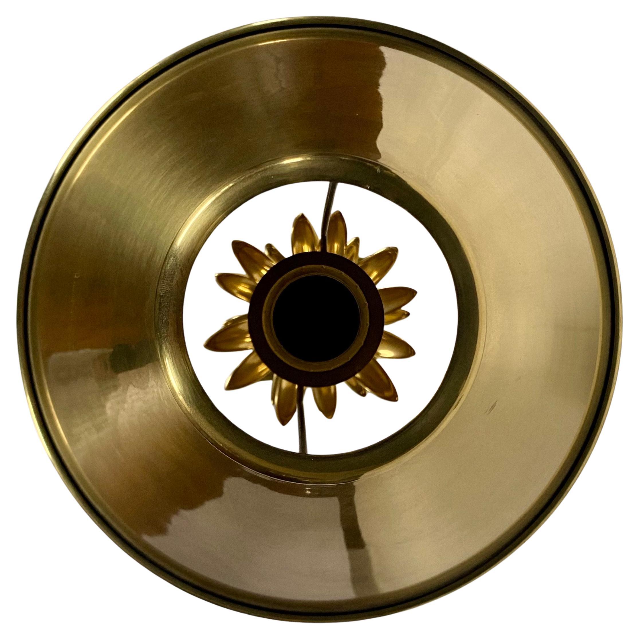 Hollywood Regency style tall palm tree form brass table lamp.  This sculptural candlestick lamp features a polished gold brass finish and is topped with a coordinating metal cone shade.   Lamp holds a standard base bulb.  Turn switch located on base