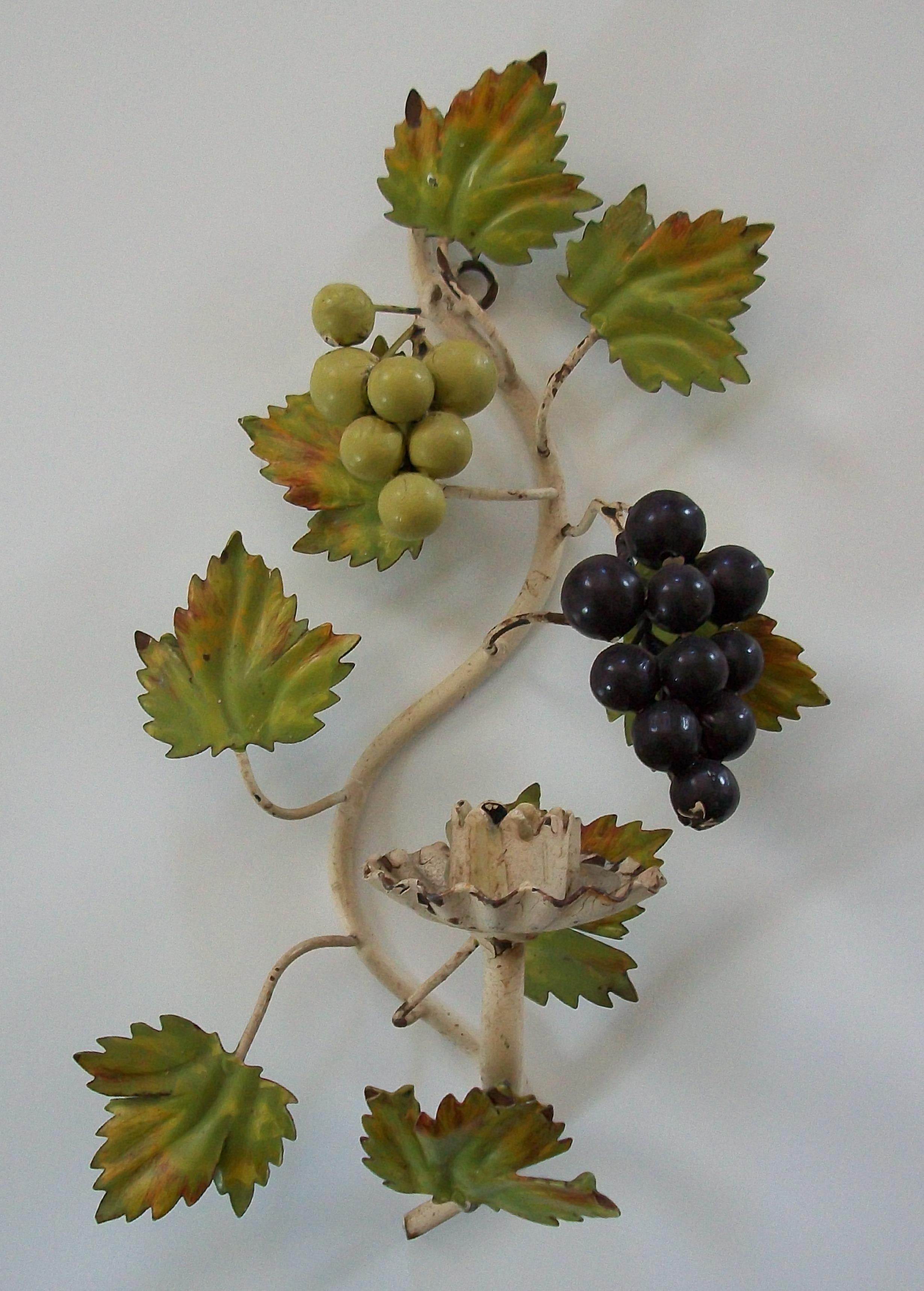 Hollywood Regency tole candle sconce - featuring bunches of red and green grapes - hand made from sheet iron and rods with hand painted realistic coloring to the leaves and fruit - unsigned - original 'Made in Italy' sticker to the back - Italy -